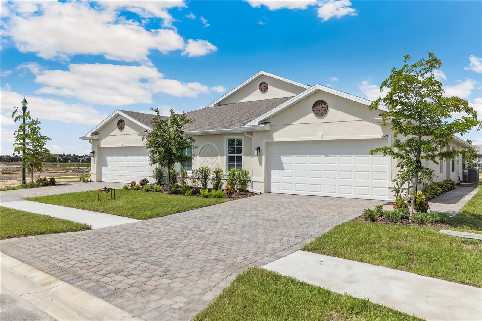 Completed Construction. Located in highly desirable North Port, Central Parc is one of the area’s newest communities off Sumter Blvd and Greenwood Dr. The Carrington villa floorplan offers a spacious owner’s suite with en-suite bath and walk-in closet, guest suite, full guest bath and den. Entertaining is effortless as the kitchen opens to the spacious great room and dining room overlooking the backyard. Enjoy upgraded standard features throughout including impact glass windows, quartz countertops in the kitchen and baths, comfort height commodes, a private laundry room, an open lanai and 2-car garage. Kitchen appliances, washer and dryer and blinds on all windows are included! The brand-new clubhouse located in the center of the community offers residents a large community pool, fitness center, pickle ball and tennis courts. Self Guided Tour Available!