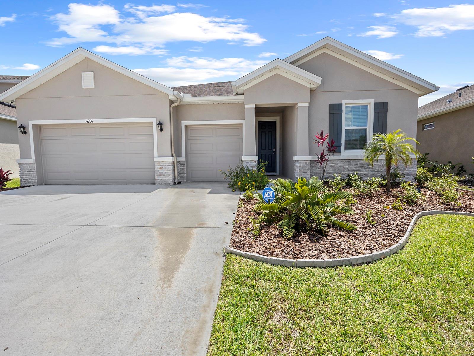 ***TURNKEY FURNISHED HOME***(May 1st - Nov 1st): $3,500 a month. Rental fees do not include additional fees & taxes added if less than 6 months. One-story tastefully appointed smart home with ADT security is all-concrete block construction. Enjoy the open concept floor plan featuring a large living room and a well-appointed kitchen with a dining area and a center island with counter-height seating overlooking a covered patio. The kitchen is equipped with under cabinet lighting, a side-by-side refrigerator, a built-in dishwasher, an electric range, microwave, blender, choice of drip coffee maker or Keurig, and a toaster oven/ air fryer in addition to everything else you’ll need to feel right at home. There are two queen guest bedrooms at the front of the home which share a jack-and-jill full bathroom, as well as a half bath and laundry room off the hall leading to the 3 car garage. The main bedroom (queen bed) with en suite bath, including garden-style tub, stand-up shower, and walk-in closet, is located at the back of the home for privacy, offering views of the backyard and green space. The most unique feature of this home is the office featuring French doors. Use it as a den/ reading room or for a dedicated workspace. No smoking. Application fee and background check required. The lease includes access to the swimming pool and clubhouse areas. Tenants must adhere to all HOA rules. Additional charges will be departure cleaning fee ($350), Sales and Resort Taxes (13 percent) and Travel Insurance (ONLY AVAILABLE to be purchased at the time of booking). Rates are subject to change without notice and reservations are not guaranteed until initial reservation deposit is received. Note: Tenant will pay for Electric. Water and Wifi included in rent.