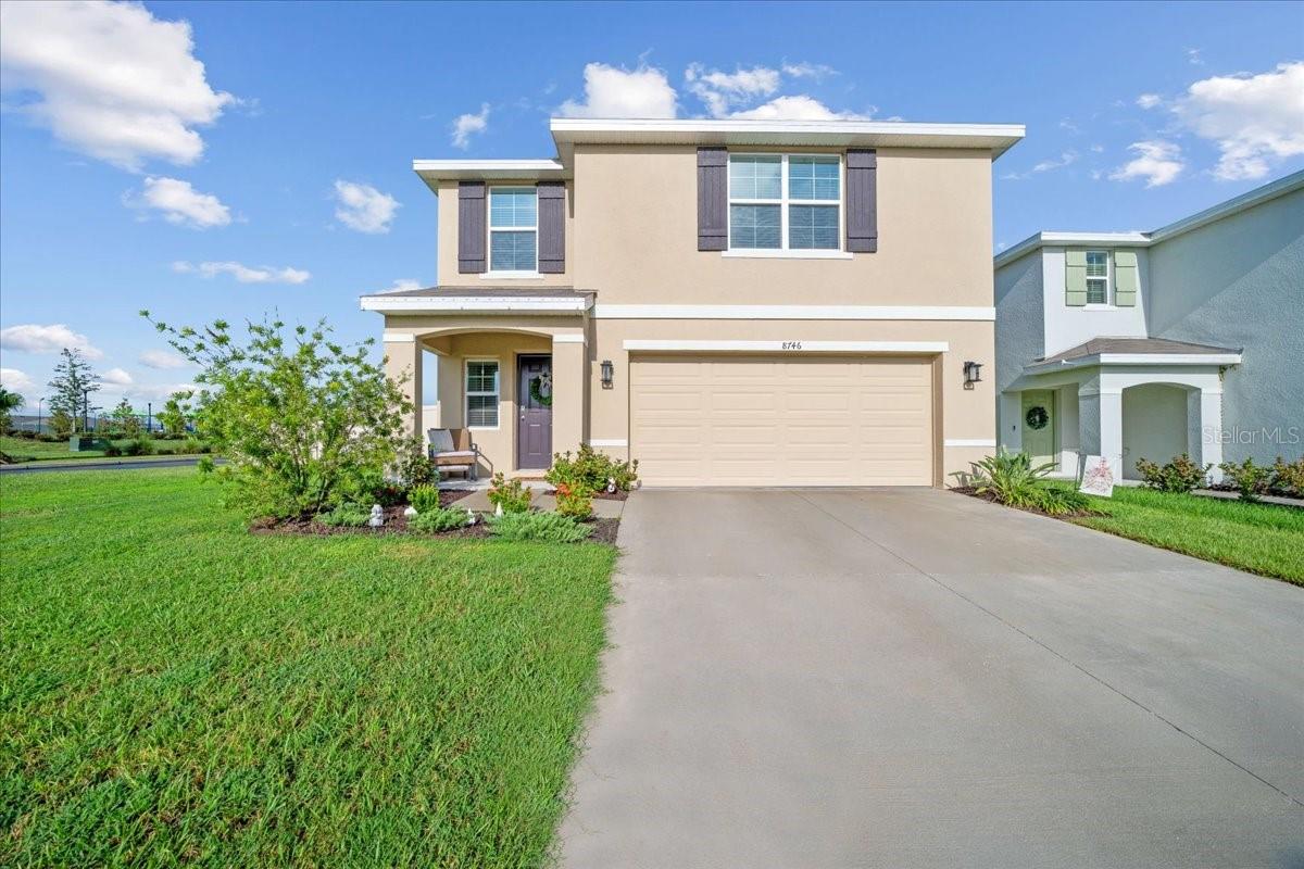 Welcome to a move-in ready corner lot home with upgrades that set it apart from standard new construction. Ideally located directly across from the community pool and playground, this property offers both convenience and lifestyle. Features include a fully fenced yard with beige vinyl privacy fencing, exterior garage lighting, and a stainless steel farmhouse sink that elevates the kitchen design. The front yard irrigation system makes lawn care easy, while large 17.5" x 17.5" tile flooring provides a modern, durable finish throughout the main living areas. Situated in a desirable Ocala neighborhood close to schools, shopping, dining, and major highways, this home combines thoughtful upgrades, a prime location, and a corner lot setting.