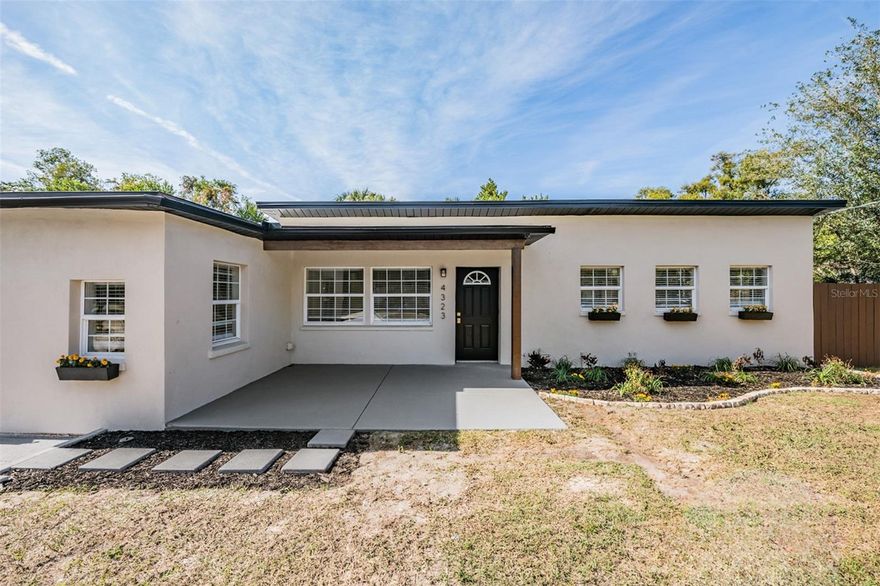Welcome home to this gorgeously renovated home in the Manhattan Manor neighborhood of South Tampa! Upon entering the home, you'll be greeted by an attractive design scheme including luxury vinyl flooring, white/clean color patterns, and gold and navy accents in the kitchen and bathrooms. The house features 4 bedrooms of great size and two full bathrooms, providing ample space for a new owner and guests. The house has lots of natural light supplemented by beautiful light fixtures. The designer kitchen features white shaker cabinets, gleaming quartz countertops, and stainless steel appliances. Each of the renovated bathrooms feature navy blue vanities, gold accents, and beautiful tiling throughout. The inviting backyard features an enclosed / screened patio and neat pavers. As a huge BONUS, this property has an additional structure with a mini-split, that can act as a separate office, storage, gym, or general extra room for a new buyer! The home is perfectly located within South Tampa, close to everything: Tampa International Airport, Midtown, Downtown, bridges to St Pete and Clearwater, restaurants, attractions and much more! Ages of major systems: Roof (1 year old), HVAC (3 years old), water heater (1 year old), and so much more! Don't miss out!