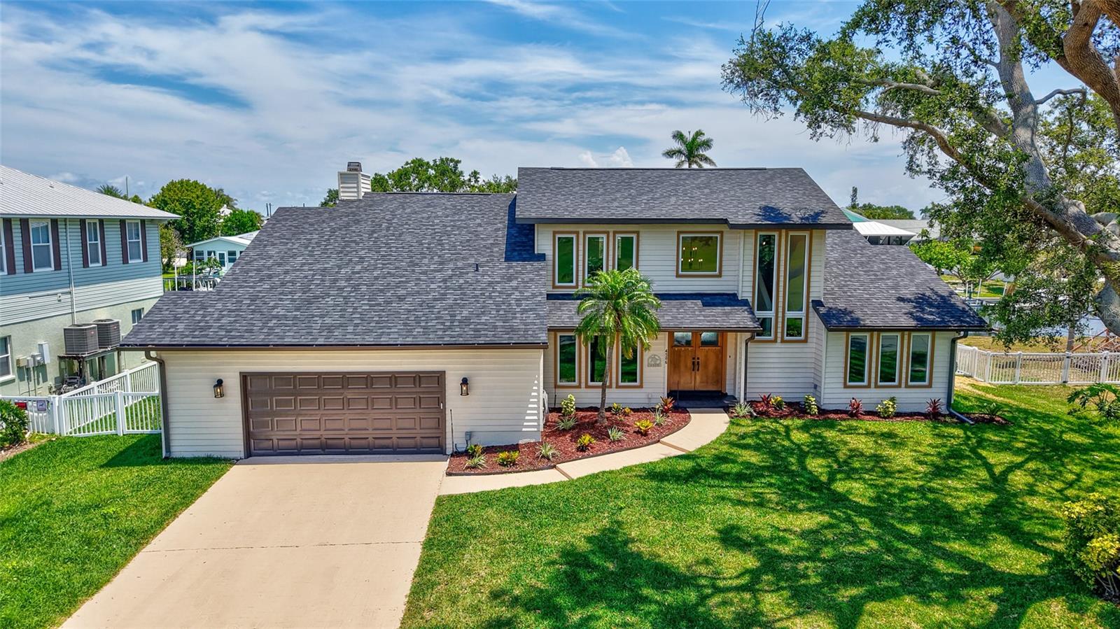 Welcome to your dream coastal escape on beautiful Snead Island! This fully remodeled 4-bedroom, 3-bath pool home sits on a deep saltwater canal with 100 feet of waterfront, boat lift, dock, and davits—offering unmatched access to the open water. Whether you're an avid boater or nature enthusiast, this backyard paradise delivers frequent sightings of manatees and dolphins right off your dock.
Inside, no detail has been overlooked. With over $350,000 in recent upgrades, this home features hurricane rated windows and doors, new luxury vinyl plank flooring throughout, freshly painted interiors, quartz countertops and backsplash, brand-new kitchen appliances, and completely remodeled baths. The open layout is filled with natural light, offering water views from multiple living areas.
The entire top floor is dedicated to a luxurious primary suite, creating a private retreat with modern finishes, generous space, and tranquil views. Downstairs, you'll find three additional bedrooms and two full baths—ideal for guests or family.
Step outside to enjoy the fenced backyard and a pool with deck overlooking the wide canal—perfect for entertaining or soaking in the Florida sun. A new roof (June 2024), upgraded plumbing and electrical systems, two newer ACs (May 2022 and June 2022), and a spacious 2-car garage add peace of mind and practicality.
This home also offers no HOA, giving you freedom and flexibility. Located on a spacious quarter acre lot with no neighbors directly across the street.
Snead Island is one of the area’s most sought-after communities, prized for its natural beauty, boating lifestyle, and relaxed pace. You’ll be just moments from Bradenton Yacht Club, marinas, parks, Terra Ceia Bay Golf & Country Club, and minutes from shopping, dining, beautiful Gulf beaches, and historic downtown Palmetto.
Whether you're seeking a full-time residence or a private waterfront getaway, this home combines modern luxury with coastal living at its finest. Don’t miss this exceptional opportunity—schedule your private showing today!