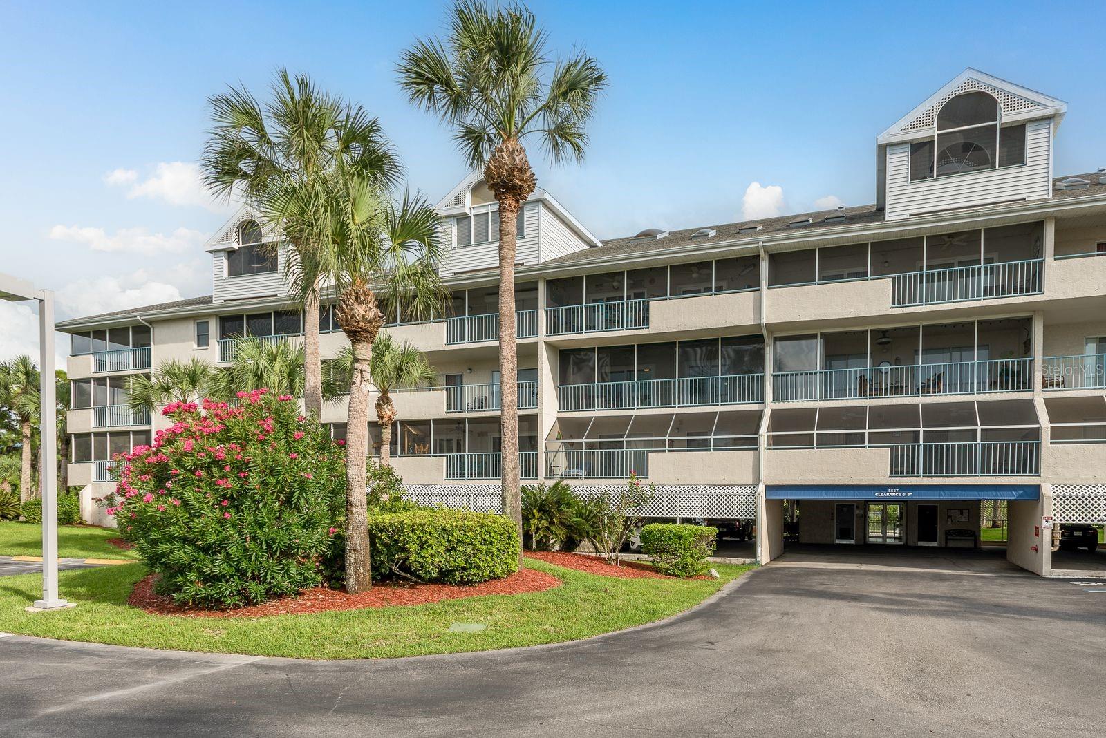 Beautiful Waterfront 2-Bedroom Condo with Wrap-Around Balcony & Airbnb Potential. Welcome to this spacious and beautifully decorated 2-bedroom, 2-bathroom condo located on a serene canal with access to boat slips. While this unit does not come with a deeded slip, there are often slips available for sale or rent — a great option if waterfront living and boating are part of your lifestyle. Boasting over 1,400 square feet of living space, this condo offers a light and airy feel with three sets of sliding glass doors that open onto a screened wrap-around balcony—perfect for enjoying both sunrise and sunset views. Inside, you'll find an open and generously sized living and dining area, plus a modern kitchen featuring: Beautiful laminate flooring, Granite countertops, Stainless steel refrigerator and dishwasher, Ample cabinetry and eat-in space. The split-bedroom layout offers privacy, with the primary suite featuring: King-size bed, Dual vanity bathroom with separate tub and shower, Walk-in closet, Private sliding door to the balcony. Additional features include a full-size laundry room with washer and dryer, and the condo comes fully furnished if desired. Plus, short-term rentals (e.g., Airbnb) are allowed, making this an excellent investment opportunity. Located on the first floor above the parking garage, the unit provides both convenience and security. Owners enjoy covered parking in the garage with one reserved space, along with additional guest parking outside. The Community offers 2 pools, community boat ramp, tennis and pickle ball courts. Monthly fees include internet, basic cable, sewer, trash, pest control, exterior maintenance, roof repair and more. Community has access to Gulf Harbors private beach also for an optional fee of $200 per year . Don’t miss your chance to own this stunning waterfront condo in a desirable community — ideal for full-time living, a vacation getaway, or an income-producing rental!