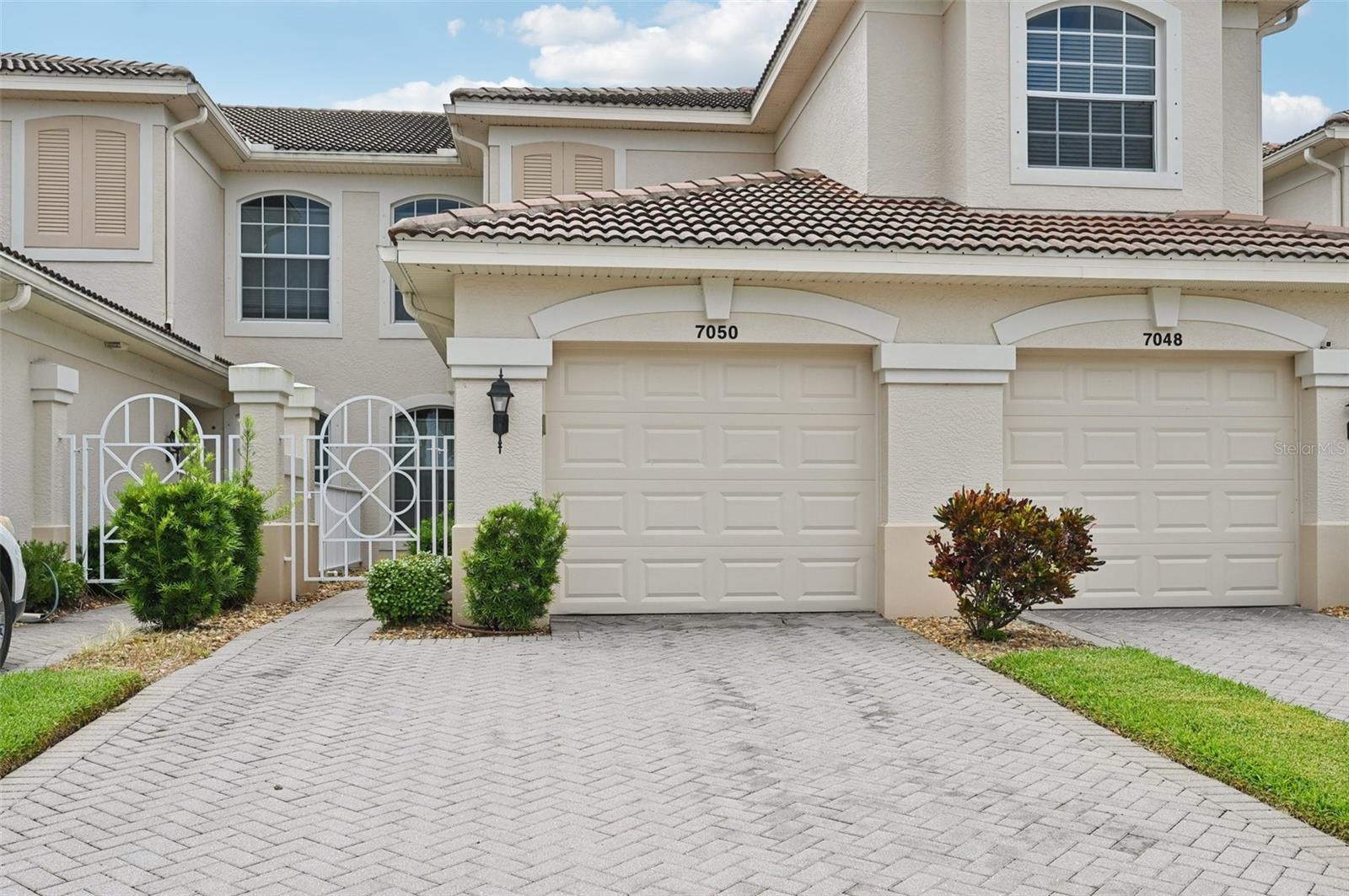 Experience the ultimate in COASTAL LUXURY LIVING at this stunning FIRST-FLOOR 2-bedroom, 2-bath condominium WITH A DEN and a 1-car GARAGE. The condo is nestled in the beautifully maintained community of ARIELLE, located in the prestigious PARLMER RANCH area of SARASOTA. This WELL-CARED-FOR home is not only TURNKEY FURNISHED but is also decorated with TROPICAL FALIR, making it the perfect FLORIDIAN PARADISE for those looking for a serene yet stylish retreat. Step into an inviting EAT-IN KITCHEN, ideal for casual dining, which seamlessly flows into an elegant FORMAL DINING ROOM, perfect for entertaining. Unwind in the SPACIOUS and COMFORTABLE living areas or enjoy the tranquil ambiance of your SCREENED IN LANAI, where you can bask in the gentle Florida breezes while OVERLOOKING A POND, perfect for birdwatching.nThe PRIMARY SUITE has direct access to the lanai, features 2 WALK-IN CLOSETS, and an ENSUITE BATHROOM featuring a PRIVATE WATER CLOSET, standing shower, and SOAKING TUB. The community of Arielle enhances this incredible living experience with its sparkling HEATED SWIMMING POOL and SPA, and charming gathering areas that encourage social interactions amongst neighbors who become friends. The community creates the perfect backdrop for evening strolls or peaceful moments outside. With easy access to exceptional SHOPPING, GOURMET DINING, and the world-renowned beaches of SIESTA KEY and TURTLE BEACH, the LEGACY TRAIL, PALMER PARK, and POTTER PARK, this is truly the ideal location for those seeking a vibrant, yet peaceful lifestyle. BEAT THE RUSH before season and SECURE YOUR SLICE OF PARADISE.