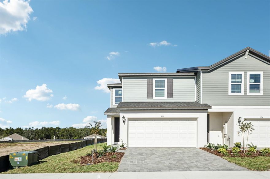 SOPHISTICATED END UNIT TOWNHOME WITH 2-CAR GARAGE * ALL-AGES, ADJACENT TO THE VILLAGES!
RESERVE AT HAMMOCK OAKS | LADY LAKE, FL  

Experience refined, low-maintenance living in this brand-new end-unit townhome just minutes from The Villages. Offering 1,566 square feet, a rare two-car garage, and elevated contemporary finishes, this residence stands apart from the interior units in both space and style.

Elevated Design & Thoughtful Layout. 

This two-story home features 3 bedrooms and 2.5 baths, with all bedrooms privately situated upstairs—creating a peaceful separation between entertaining and everyday living. 

The main level showcases rich, darker wood-look laminate flooring that delivers a striking, modern contrast to the bright, open living spaces. The kitchen is beautifully appointed with: Tall white shaker cabinetry, Crisp white quartz countertops, Stainless steel appliances, A generous island with bar seating, Open sight-lines to the Great Room and backyard. 

The seamless flow makes it ideal for entertaining while maintaining a warm, inviting feel. 

Upstairs, the primary suite and guest bedrooms offer comfortable retreats, while the bathrooms are finished with oversized tile and quartz counters that mirror the kitchen’s upscale aesthetic. A convenient powder room on the first floor adds practicality for guests. 

A Premium End-Unit Advantage. 

As an end unit in a four-residence building, this home offers: Additional natural light, Greater privacy, A highly desirable two-car garage (interior units feature only one-car garages). 

It’s the perfect blend of space, function, and style. 

Built for Modern Living. 

Energy-efficient construction, contemporary finishes, and low-maintenance design allow you to enjoy more of what matters—without the upkeep. 

Resort-Inspired Community Amenities. 

Living in Reserve at Hammock Oaks means access to: Resort-style swimming pool, Pickleball courts, Walking paths and green spaces, A welcoming, all-ages atmosphere, Prime Lady Lake Location.

Ideally positioned adjacent to The Villages, you’re minutes from shopping, dining, golf, entertainment, medical facilities, and everyday conveniences—while enjoying the benefit of new construction in a growing area. 

End units with two-car garages in this community are limited.
If you’re looking for modern design, energy efficiency, and an unbeatable location, this is the one to see. 

Schedule your private showing today.