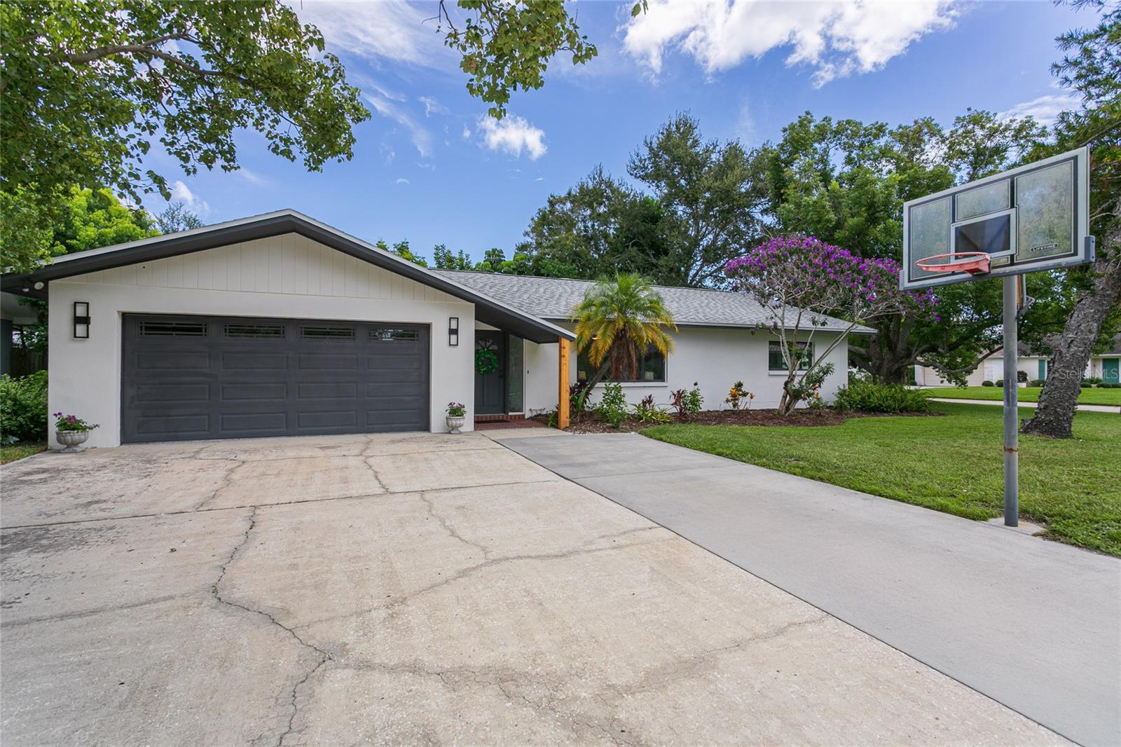 ***Luxury Living/ New Roof 2024/ Fully Renovated Home**** Impeccably updated 3- bedroom, 2- bath home with a 2-car garage on a highly desirable corner lot. Recent upgrades include a new roof (2024) , water heater (2025) fence (2025), modern windows (2014), HVAC (2015). The Fully renovated kitchen (2025) boasts quartz countertops, new soft closed cabinets, and stainless steel appliances. The spa-inspired bathrooms (2025) , luxury vinyl flooring, (2025) and a renovated epoxy finished garage (2025) add modern elegance throughout. Freshly painted from inside and out, with a spacious fenced backyard, this home is move-in ready, outside a flood zone and no history of flooding, and perfect for both sophisticated entertaining and everyday living.