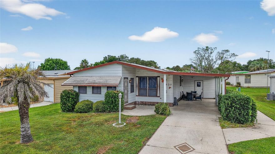 Come take a look at this well maintained home in The Villages at Orange Blossom Gardens!  This Doublewide boasts a new roof in 2019, new HVAC in 2018, new engineered laminate wood throughout in 2019 and a golf cart garage with Golf Cart Included (2012 Yamaha Drive - gas powered)!!  The home is sold furnished and features a spacious primary bedroom with full bedset, guest bedroom with walk in closet-furnished, and a bonus Florida room that is fully enclosed and has an optional third bedroom set up.   Kitchen is fully stocked and features a great layout with a breakfast bar / prep area leading into your dining area that hosts a large built in bar / hutch.   This home has everything and comes with everything while being in a perfect location in the Villages!  Your moments from Pools and Parks, restaurants and shopping and all the amenities the Villages has to offer! Come take a look today!