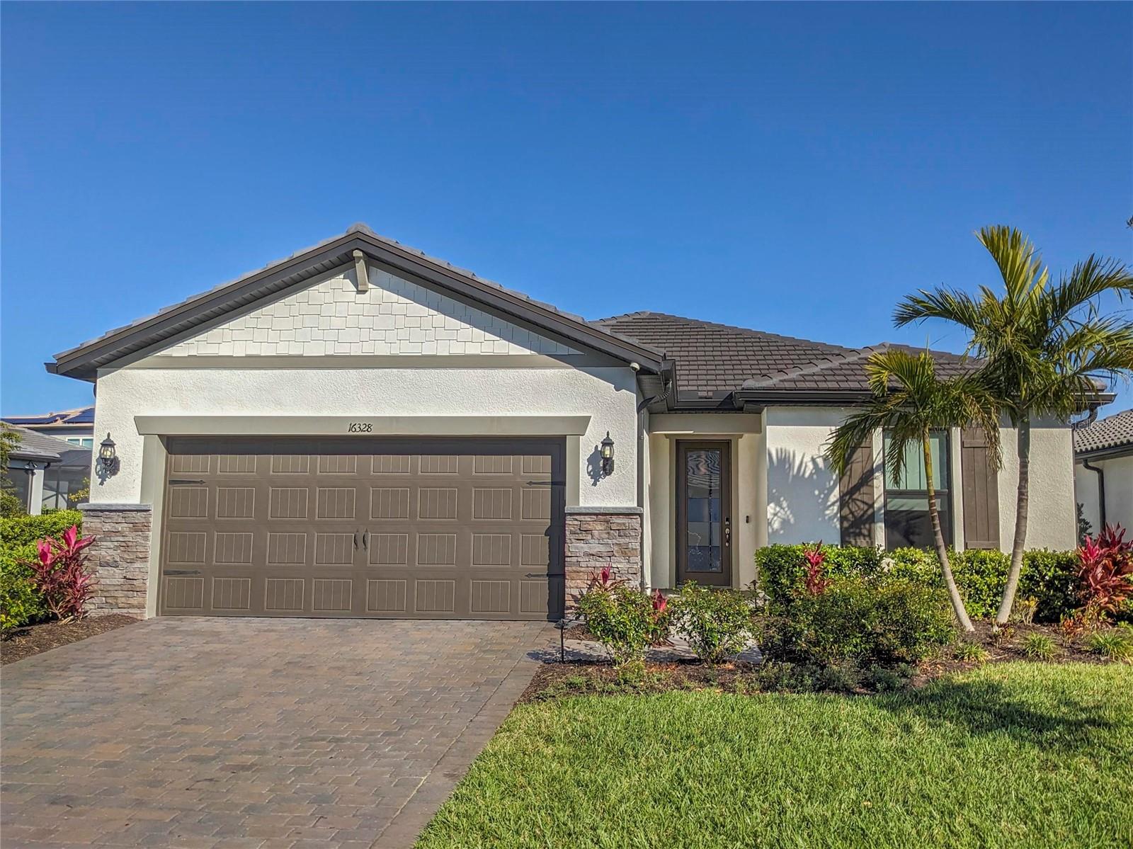This unfurnished 3 bedroom, 2 bathroom pool home with a den and lake views is located in the highly desirable Sapphire Point community. This home features a long list of upgrades including an etched glass front door, trey ceilings with crown molding in the living room and master bedroom, built-in in the master closet, a pool with a waterfall, upgraded fixtures and appliances throughout, and so much more! The corridor foyer leads to a great room floorplan with a large living space, dining area and kitchen. The oversized eat-in kitchen features top-of-the-line appliances, stone countertops, a large island with breakfast bar, a glass top stove with an exhaust hood, a closet pantry and a striking glass backsplash. The living room has sliding glass doors to the screened-in patio featuring a sparkling pool with waterfall and lake views, paver patio, and a built-in kitchen with grill. The split floorplan has the master suite at the rear of the home. The master bathroom has his and her sinks, a garden tub, a walk-in shower, a private toilet room, a large walk-in closet that features built-in shelving and a spare closet with deep shelving. Toward the front of the home and off the foyer are two spare bedrooms, a spare bathroom with a walk-in shower, a den, a laundry room complete with washer and dryer, and a two car garage. This home includes a whole home water system and includes lawn service, pool service and pest control in the rent. Sapphire Point is a gated community offering exceptional amenities, including a resort-style community pool with zero entry, a state-of-the-art fitness center, basketball court, fire pit, dog park, and 60 acres of preserve. Please allow up to 3 weeks after lease signing for community approval before move-in. We score every application. If an application doesn’t score high enough, the resident may be required to place the equivalent of two months’ rent in a security deposit. Please be aware that leasing this property includes a non-optional Home Assistant Services Package that will cost an additional $30 per month. These services and their cost are separate from Tenant’s monthly rent payment and all other payments described in the Lease or any separate Lease addendums. The Home Assistant Services offered are described in the Resident Welcome Packet which can be viewed here: www.sarasotamanagement.com/home-assistant/