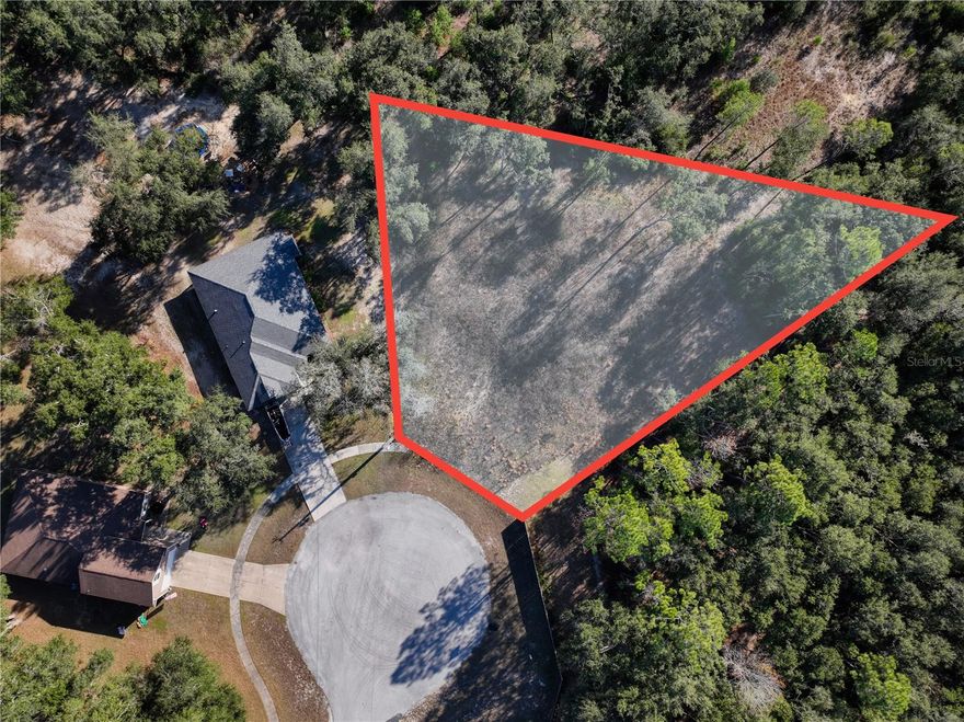 Come experience Old Florida charm in the small town of Bronson. This spacious, ½-acre lot is the last remaining parcel in the Deer Trail subdivision, a quiet community of just 11 lots with paved streets and friendly neighbors. Tucked away at the end of a cul-de-sac, the setting offers space and privacy while still being part of a welcoming neighborhood. The lot has been partially cleared and natural appeal. City water is available, making the path to building even easier. No HOA and not in a flood zone. Enjoy rural living with everyday convenience—less than 30 miles to Gainesville, the University of Florida, Shands Hospital, and more. Opportunities like this don’t come around often—secure your place in Deer Trail and build the home you have been dreaming of.