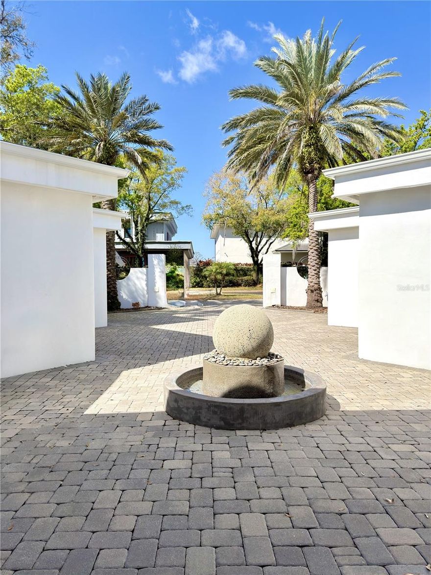 LUXURIOUS ART/DECO CONTEMPORARY HOME ON THE WATERFRONT WITH BOAT DOCK IN THE BEAUTIFULL POINTE TIBET IN WORLD FAMOUS BAY HILL. *FREE BOAT WITH PURCHASE* BACKED TO A PEACEFUL CANAL LEADING TO THE WELL-KNOWN BUTLER CHAIN OF LAKES (LAKE TIBET). ENTER THROUGH DRAMATIC 9 1/2 STEEL DOOR, FULLY AUTOMATED SMART HOME, CAN TURN ON & OFF SWITCH FROM ANYWHERE IN THE WORLD. SWAROSKI CHANDELLIERS, HARDWOOD FLOORS, LARGE KITCHEN WITH CUSTOM CABINETRY, GALAXY GRANITE COUNTERTOP. FULLY EQUIPPED HOME THEATRE FOR TWELVE WITH T.V. BEHIND MIRROR AND STATE OF THE ART 7.1 SURROUND SOUND AUDIO, VIDEO SYSTEM. FULL BATH AND BAR AREA OVERLOOKING POOL, LIVING AND FAMILY ROOM. LIGHTING SYSTEM IN GAME ROOM. LARGE LANAI WITH SOLAR HEATED POOL & SPA, AQUALINK CONTROL. NEW APPLIANCES IN SUMMER KITCHEN, GAS STOVE. 4 CAR GARAGE! FOR FULL FURNISHING WITH AUDIO AND VIDEO EQUIPMENT IN FAMILY ROOM AND GAME ROOM. THIS TUCKED AWAY COMMUNITY W/ 16 CUSTOM HOMES IN A GATED (RECORDED) ENTRY, TREE LINED AMAZING VIEW. CLOSE TO, THEME PARKS, RESTUARANT ROW, LIBRARY, DR. PHILLIPS AREA. UPDATED EXTENDED HOME THEATRE 24X14, BATH & BAR ROOM MUST SEE