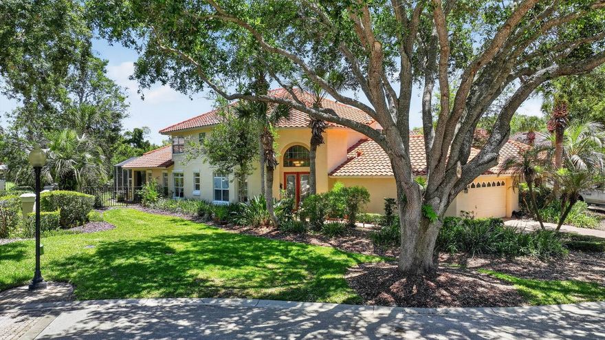 Located within the exclusive gated community of Hammock Dunes, this Spanish Mediterranean-style 3-bedroom, 2.5-bath residence offers timeless architectural character, golf course views, and an exceptional opportunity to personalize within one of Palm Coast’s most sought-after private communities. Surrounded by mature landscaping, the home features a tile roof, paver driveway and walkway, and a welcoming French door entry.

Inside, the functional floor plan offers a blend of formal and casual living spaces. A formal dining room is positioned just off the entry, while a separate family room with a half bath and corridor laundry room provides additional flexibility and direct access to the garage. Upstairs, two guest bedrooms share a full bathroom, creating comfortable accommodations for family and guests.

The main living area and spacious kitchen overlook the rear patio and golf course beyond. The kitchen features abundant cabinetry, tile countertops, a built-in desk area, and ample prep and storage space. Wood-look flooring extends throughout the main living space and continues into the first-floor primary suite, which includes a walk-in closet, dual vanities, a jetted soaking tub, and a walk-in tiled shower.

French doors lead to a covered and screened tile patio overlooking the Hammock Dunes Links Course, offering a peaceful outdoor setting framed by lush landscaping and mature trees. With solid bones, a desirable layout, and an outstanding location within Hammock Dunes, this home presents an excellent opportunity for a buyer to update and create their own private coastal retreat.