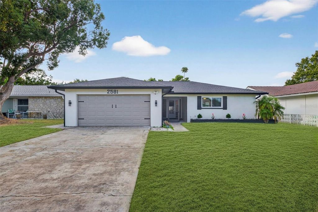 Photo of 2581 Bramblewood Drive W, Clearwater, FL 33763 (MLS # TB8452367)