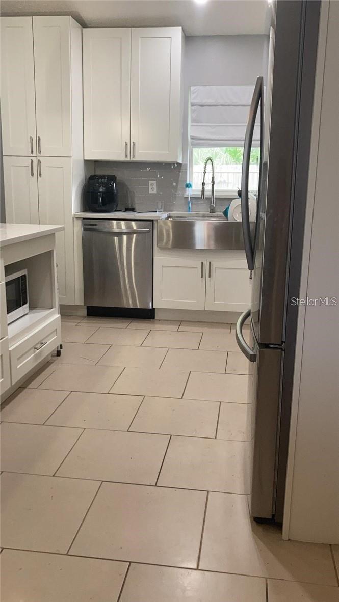 Photo of 10470 Coconut Grove Lane, Orlando, FL 32825 (MLS # S5152523)
