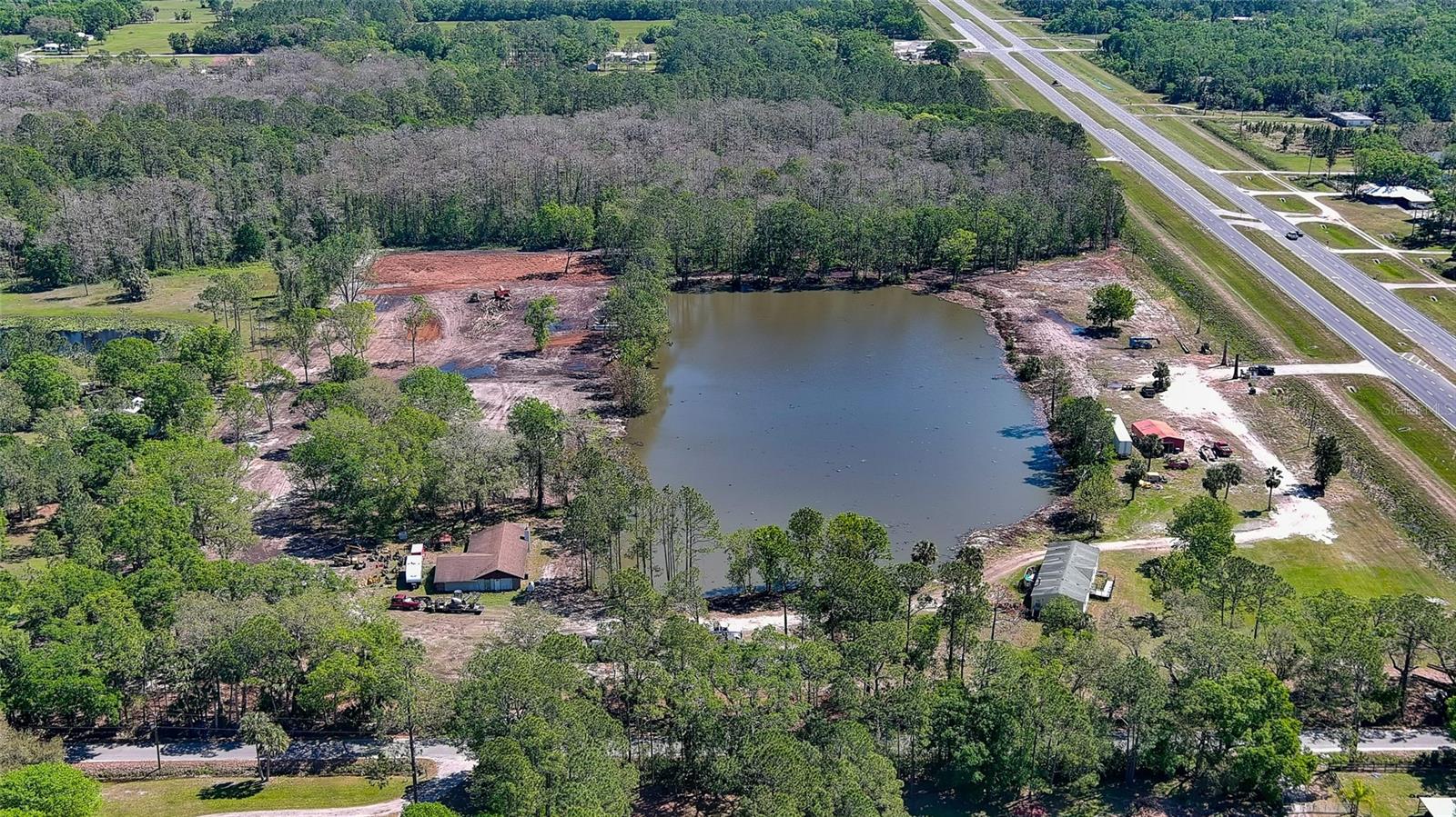 17.45 Acres with 6 acre lake in Samsula. Ideal location for a Nursery! Beautiful property, perfect location for country estate, horses or small farm. Two adjacent parcels being sold together: 123 Cucumber is 7.14 acres with X acres part of the lake and has a 2004 3/2 mobile home and prefabricated metal RV carport and small office bldg. The adjacent parcel:722401020070, 125 Cucumber is 10.31 acres with X acres part of the lake and has a 1989 2/2 concrete block home and small barn for animals. Location on the Corner of Cucumber Land and SR-44, this property is an ideal place for a nursery or small farm. Close to I-95 and 415.