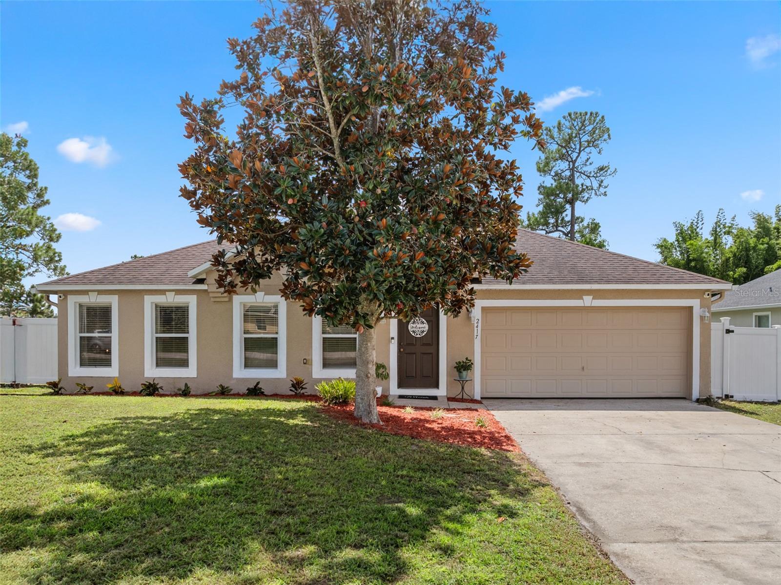 One or more photo(s) has been virtually staged. Looking for a spacious home with NO HOA? Check out this 4-bedroom, 2-full bath home! The entire kitchen has been remodeled top to bottom with an open floor plan along with Vinyl Plank flooring and a new water heater. If a huge backyard is calling you then this is the home for you! There is a view of Lake Elizabeth and no direct rear facing neighbors. The backyard is great for family get-togethers or entertaining. Multiple other upgrades include a renovated screened deck, stainless-steel appliances, InstaView style refrigerator, granite countertops, modern fixtures, recessed lighting, ceiling fans and the septic pump has also been replaced. Great location minutes from Daytona State College Deltona Campus, Halifax Medical, shopping, restaurants and central to beaches and Amusement Parks. Come Check It Out!
