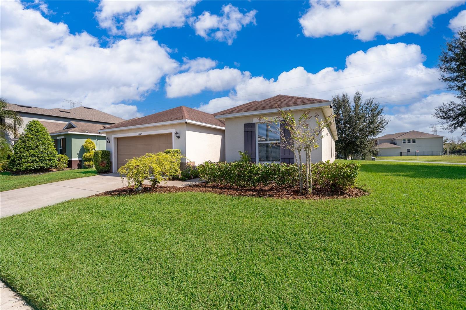 Welcome home to 13065 Boggy Pointe Drive in Orlando, Florida, a spacious and well-maintained beauty just waiting for you and your family to create new memories! Situated on a large corner lot in Sawgrass Plantation, this 3-bedroom, 2-bathroom home boasts over 1,800 sq. ft. of living space plus an office/den—perfect for working from home or creating a cozy reading nook. Step inside and you’ll immediately notice the wood-like tile flooring that flows beautifully through the common areas, offering both style and durability. The front entry opens to a welcoming hallway, where you’ll find two bedrooms conveniently located across from each other, along with a linen closet for extra storage. Continue down the hall to discover the bright and open main living area, designed for both relaxation and entertaining. The spacious den/office area connects effortlessly to the living room through a charming pass-through window, allowing conversation and light to flow freely throughout the space. Just around the corner, the chef’s kitchen awaits—complete with a closet pantry, ample cabinetry, and a cozy breakfast nook overlooking the backyard. Sliding glass doors open from the kitchen, extending your living space outdoors and inviting you to enjoy Florida’s sunshine in the large backyard—ideal for pets, play, or weekend gatherings. The guest bathroom offers a classic shower/tub combo, and the indoor laundry room with washer and dryer hookups adds everyday convenience. Retreat to the primary suite, where natural light fills the room, and the spacious en suite bathroom provides the perfect place to unwind at the end of the day. Sawgrass Plantation offers fantastic community amenities including a playground, clubhouse, pool, and scenic walking paths that make it easy to stay active while staying close to home. Location is key, with quick access to major Central Florida destinations like Lake Nona, Medical City, and nearby roadways such as 417 and the Florida Turnpike, providing a short commute to Downtown Orlando or the sunny coastal cities of Cocoa, Titusville, and Melbourne. Schedule a showing and fall in love today!