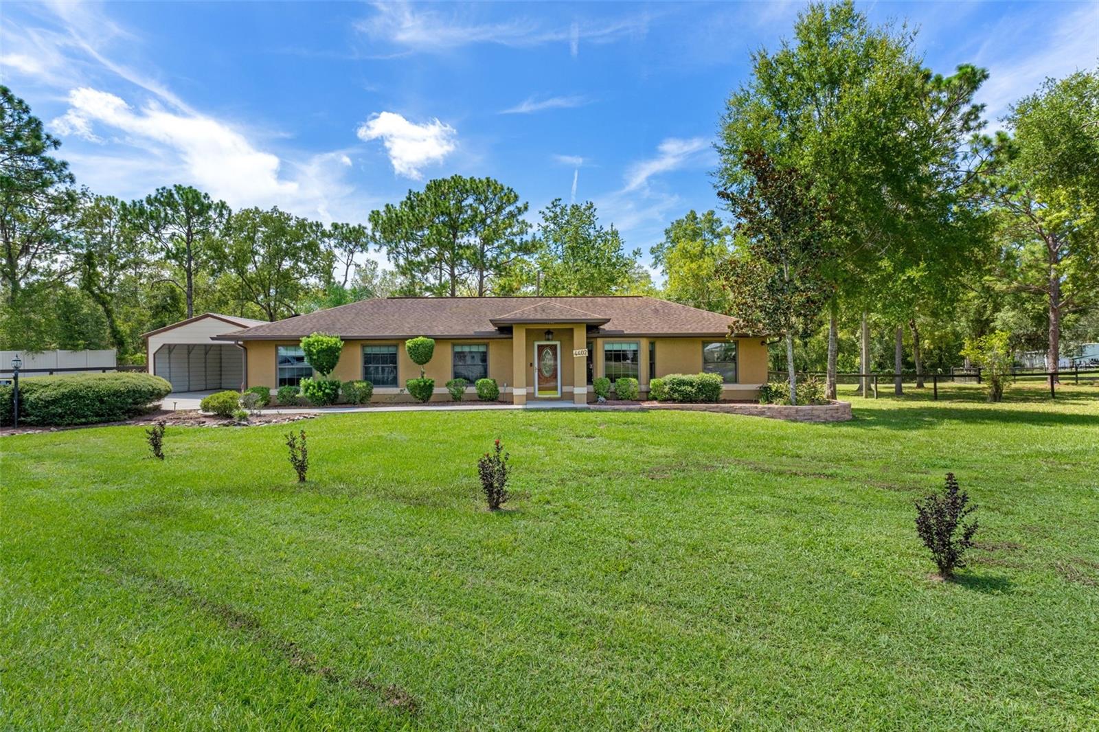 Under contract-accepting backup offers. One or more photo(s) has been virtually staged. This charming 3-bedroom, 2-bath home is nestled on a generous 0.93-acre corner lot, offering space, privacy, and endless potential. With no HOA restrictions, you’ll have the freedom to make this property truly your own. Step inside to discover an open-concept layout with cathedral ceilings in the living and dining areas. The kitchen is both functional and stylish, featuring a tile countertop, backsplash, pantry, and a double oven—perfect for home cooks and entertainers alike. Relax year-round in the enclosed porch with vinyl windows and screens, or step outside to your deck and above-ground pool, ideal for lounging and entertaining. The fully fenced backyard includes a storage shed, carport, and RV hookup, with a second entrance from S Leisure Blvd for added convenience. Major updates include Roof (2015), Solar panels – paid off, new 2.4 ton York Heat Pump and Thermostat, Double pane, double hung windows (2019) and new carpet. Bring your RV, boat, or outdoor toys—there’s room for it all. Whether you’re dreaming of a garden, workshop, or just more room to roam, this property is the perfect place to create your personal outdoor oasis.