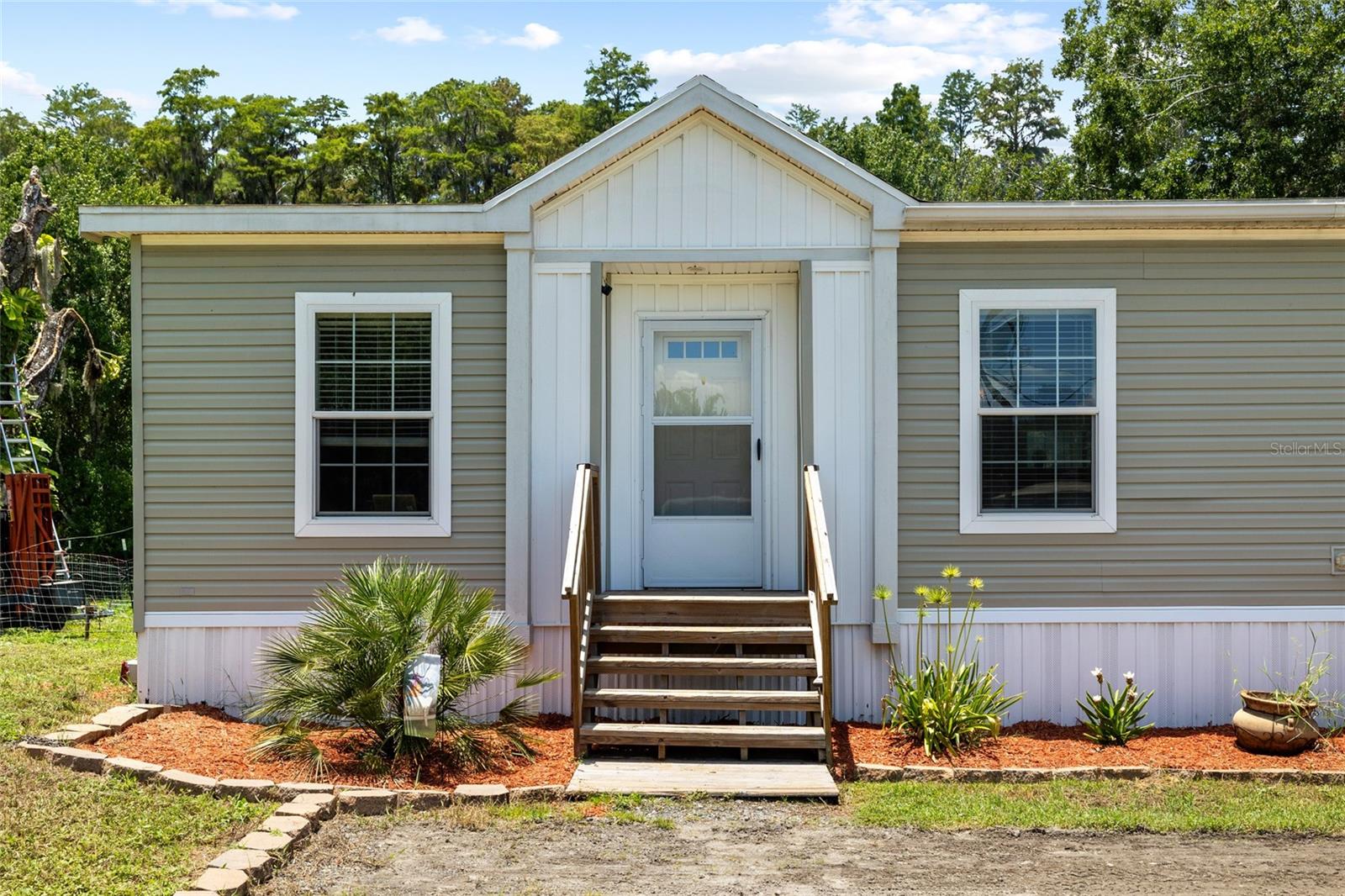 3 Bed, 2 Bath on ½ Acre with No HOA!
Welcome home to this charming 3-bedroom, 2-bath 2021 manufactured home nestled on a spacious ½-acre lot with lush conservation land behind—offering privacy, nature views, and no rear neighbors. Zoned Agricultural, this property gives you the freedom to raise chickens, plant gardens, and enjoy the rural lifestyle without restrictions.
Step inside to a welcoming open floor plan featuring vinyl flooring in the kitchen and bathrooms, with cozy carpet throughout the living spaces and bedrooms. The layout is ideal for families, entertaining, or simply enjoying the peaceful surroundings.
With no HOA or CDD fees, you're free to live how you choose—bring your toys, build a workshop, or just relax and enjoy the quiet. Whether you're looking for a homestead or a private retreat, this property offers the perfect blend of comfort, space, and freedom.