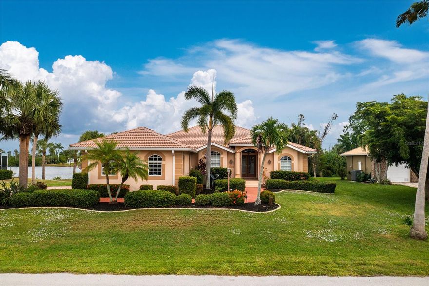 Discover this beautifully maintained waterfront pool home situated on a spacious half-acre lot in one of Punta Gorda’s most sought-after neighborhoods. Surrounded by well-kept homes and mature landscaping, this quiet and upscale area offers the perfect blend of privacy, space, and convenience. Offering 3 bedrooms, 2 bathrooms, a 3-car garage, and 1,867 square feet of living space, this property delivers the ideal Florida lifestyle both inside and out. Best of all, the home is being sold turnkey furnished, making it ready for immediate enjoyment or seasonal use. From the moment you arrive, the decorative driveway, lush tropical landscaping, and impressive curb appeal set the tone for what’s inside. The home features a bright open floor plan with split bedrooms, a formal dining area, spacious breakfast nook, and a dedicated billiard room perfect for entertaining. The kitchen is designed for both functionality and style, complete with stainless steel appliances, dual convection ovens, granite countertops, and a large pantry. The primary suite offers a relaxing retreat with dual walk-in closets and recessed reading lights, while both bathrooms showcase granite counters and slate tile finishes. Major updates include a BRAND NEW tile roof installed in 2023 and a water heater replaced in 2021, giving peace of mind to the next owner. Step outside to the expansive screened lanai where multiple rooms of the home open directly to the outdoor living space. The large heated pool overlooks peaceful lake views, creating the perfect setting for relaxing, entertaining, kayaking, or enjoying Florida wildlife right from your backyard. The epoxy-coated driveway and pool deck add durability and a clean, polished look. Located just minutes from Fishermen’s Village, downtown Punta Gorda, Sunseeker Resort, golf courses, shopping, restaurants, public parks, boat ramps, and the Punta Gorda Airport, this home places you close to everything while still offering the tranquility of waterfront living. Spend weekends exploring Charlotte Harbor, the Peace and Myakka Rivers, or enjoying the popular Saturday farmers market downtown. This is more than just a home — it’s a chance to enjoy the laid-back waterfront lifestyle Punta Gorda is known for. Schedule a pirvate tour today!