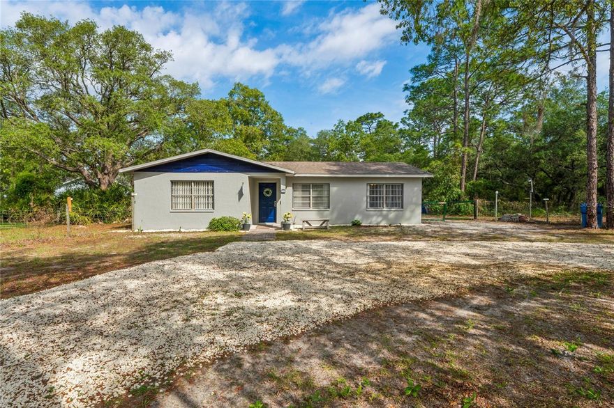 Move-In Ready on 1.13 Acres – Priced Below Market Value! Welcome to this beautifully updated 3-bedroom, 2-bath home situated on 1.13 agricultural acres in a peaceful Brooksville location. Corner lot with circular driveway and directly borders the extensive Withlacoochee State Forest & walking trails, this property offers exceptional privacy.  This move-in ready home features fresh interior and exterior paint, updated flooring, and no carpet throughout for easy maintenance. Enjoy the outdoors year-round from the screen-enclosed lanai, perfect for relaxing in your private setting. The fully fenced backyard includes both front and rear gate access, making it ideal for pets, recreational vehicles, or equipment. 
Additional highlights:
* Security cameras & video doorbell included
* Not located in a flood zone
*Zoned agricultural – flexibility for a variety of uses
* Priced under market value for a quick sale!
Opportunities like this—acreage, privacy, and value—don’t come around often.
* Schedule your private showing today!