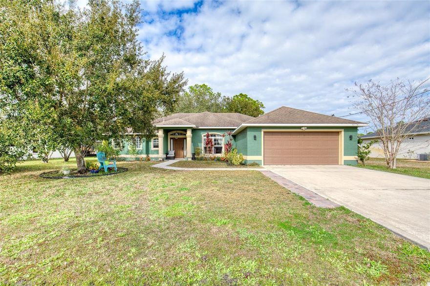 This well-maintained Seminole Woods home is set on a quiet street in a desirable Palm Coast neighborhood. The entry opens into a formal dining and living area, where tile flooring extends through the main living areas for a streamlined, easy-care finish. Large sliding pocket doors at the back of the living room tuck completely out of sight, extending the living space out to the covered lanai and creating an easy indoor-outdoor flow. The kitchen is centrally located and designed for everyday functionality, with granite countertops, 42-inch cabinets, a breakfast bar, and an adjacent eat-in area overlooking the yard. The owner's suite is positioned for privacy and includes tray ceilings and French doors that open directly to the covered lanai. The en-suite bath offers an extra-large walk-in closet, double sinks, a sunken tub, and a tiled walk-in shower. The bedroom wing features LVP flooring, with an oversized second guest bedroom that provides comfortable space for visitors. From the main living area, the covered lanai is easily accessible and well-suited for everyday use or hosting. The backyard is generous in size, with room for play, gardening, or future improvements such as a pool or outdoor kitchen. Hurricane shutters add an extra practical feature. Set in the Seminole Woods area of Palm Coast, this home offers a quiet neighborhood feel while keeping you close to shopping, dining, parks, and hiking/bike trails, making it easy to enjoy both daily routines and weekend downtime. Plus, Flagler Beach and the Atlantic shoreline are just a short drive away.