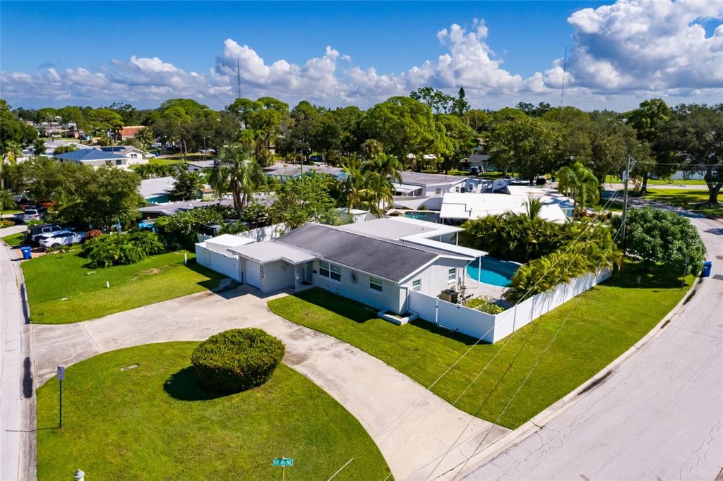 Photo of 8801 Sunlit Cove Drive NE, St Petersburg, FL 33702 (MLS # TB8433466)
