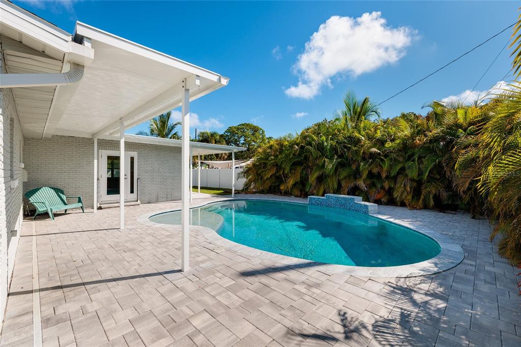 Photo of 8801 Sunlit Cove Drive NE, St Petersburg, FL 33702 (MLS # TB8433466)