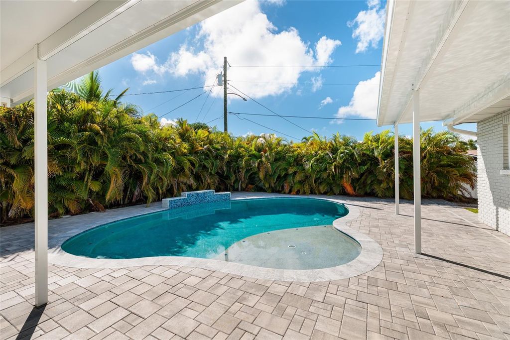 Photo of 8801 Sunlit Cove Drive NE, St Petersburg, FL 33702 (MLS # TB8433466)