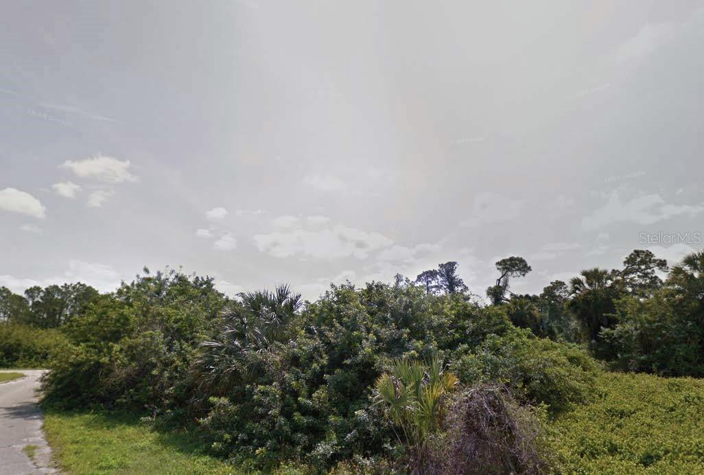Build your dream home or invest in this ideally located residential lot in the growing city of North Port. Situated on Hampshire Circle, between Legen Ave and Lestock St, this 10,000 sq ft lot backs directly to I-75, offering excellent access for commuters while still nestled in a quiet subdivision. Zoned AC6. Conveniently located near schools, shopping, golf courses, and just a short drive to Gulf beaches and Charlotte Harbor. All information is deemed reliable but should be independently verified.