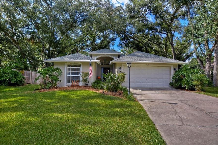 Pristine and truly gorgeous, this exceptional home is tucked inside a quiet, secluded gated community with camera-controlled access, offering privacy, security, and peace of mind—all in the heart of Tampa. Enjoy the perfect balance of tranquility and convenience, with countless businesses, shops, restaurants, and everyday essentials just minutes away. From the moment you enter, you are welcomed by an open, airy floor plan with soaring vaulted ceilings that create an elegant and inviting atmosphere. The designer kitchen is a dream come true, featuring sparkling Cambria Britannica quartz countertops, solid wood 42" cabinetry, porcelain tile flooring, stainless steel appliances, and a built-in microwave set into a spacious center island—perfect for entertaining and everyday living. Both bathrooms have been beautifully remodeled with rich wood cabinetry, marble vanity tops, and porcelain tile flooring. The primary suite is impressively large, offering a peaceful retreat with beautiful views of the fish pond and patio. The master bathroom features dual sinks, a luxurious frameless glass shower, and a separate garden tub—creating a spa-like escape right at home. A special highlight of this home is the bonus room with its own private bathroom, ideal for guests, an in-law suite, home office, or studio. Step outside to a breathtaking backyard oasis set on an oversized pie-shaped lot of over ¼ acre. The outdoor space feels like a private park, complete with a large pergola with canopy, custom deck, tranquil fish pond, and lush landscaping. The yard is enriched with an incredible variety of tropical fruit trees, including coconut, lemon, lime, mandarin, grapefruit, guava, mango, anona, guanábana, and carambola—your own private orchard right at home. Adding even more value, one side of the home offers ample space for parking a large vehicle, boat, RV, or work truck—perfect for those who need extra room without sacrificing curb appeal. Impeccably maintained and filled with pride of ownership, this home is located in a secure, camera-gated community surrounded by vibrant city life. With everything you need just moments away, this is a rare opportunity you don’t want to miss. I promise—you will not be disappointed!