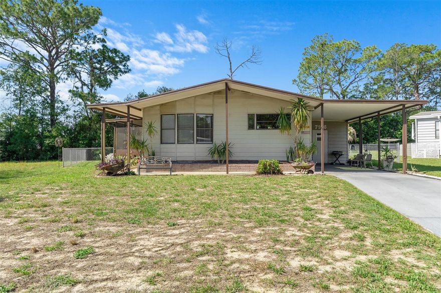 Welcome home to this adorable and move-in ready 1986 doublewide manufactured home featuring an oversized fenced backyard and a bright open-concept layout connecting the living room, dining area, and kitchen. The spacious primary bedroom includes a private en suite bath, creating a comfortable retreat at the end of the day. 
Major updates have already been completed for peace of mind, including a new chain-link fence, new hurricane straps and new shingle roof  in 2020, in 2021 new heat pump, in 2023 new ductwork.  In 2024 the porch was re-screened and a new door was added for easy backyard access. In 2025 new lighting and ceiling fans were installed. 2026 improvements include commercial-grade luxury vinyl plank flooring and updated smoke detectors.  There is flooring available to complete the guest bedroom if so desired. The laundry and workshop are located in the utility room off the carport.
This home has been lovingly maintained, and is ready for its new owners to move right in. Some furniture is negotiable, making this an even easier transition. Don’t miss this cute and updated home with plenty of outdoor space to enjoy!