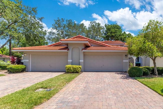 Welcome to your fully furnished and beautifully updated Naples floor plan in the gated Sandpointe community of Dr. Phillips. Tucked away on a quiet cul-de-sac, this 3-bedroom, 2.5-bath townhome features a private gated courtyard, soaring ceilings, and abundant natural light. The renovated kitchen includes stainless steel Whirlpool Gold appliances, level 5 granite countertops, upgraded cabinetry, and a custom mosaic backsplash extending into the breakfast nook. Luxury wood flooring flows through the open dining and living areas, leading to a screened-in patio. The first-floor primary suite offers a walk-in closet and spa-like bath with dual vanities, a jetted tub, and separate shower. Upstairs, you’ll find two spacious guest rooms and a shared bath with a split layout for added privacy. This home comes with a new tile roof, Trane HVAC, Ecobee thermostat, plantation shutters, washer & dryer, and water heater. Community amenities include a heated pool, clubhouse, tennis & Bocce Ball courts, and fitness studio—just steps from your door. Enjoy maintenance-free, resort-style living with top-rated schools, walkability to Trader Joe’s, The Marketplace, and major highways. Welcome to Sandpointe—one of Dr. Phillips’ most convenient and charming communities.