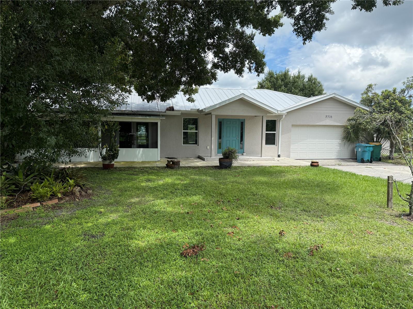 One or more photo(s) has been virtually staged. Waterfront Oasis Awaits! 3/2 with Attached Garage. Experience exceptional fishing and boating from this Punta Gorda gem, where a fully fenced yard provides plenty of space for pets and children to play. With over 200 feet of concrete seawall along the peaceful shores of Shell Creek, this property offers direct, bridge-free access to the Peace River, Charlotte Harbor, Myakka River, Boca Grande, and the Gulf of Mexico. Step inside to discover a beautifully updated split floor plan combining comfort and style. The expansive living room features large windows framing serene water views, while the Primary Suite offers French doors to a wraparound screened lanai, perfect for enjoying the tranquil setting. The spa-like ensuite includes a claw-foot tub, pedestal sink, and spacious tiled shower with bench. Two generously sized guest bedrooms each boast cedar walk-in closets and charming wood-plank ceilings, sharing an updated bath with tiled shower and cedar linen closet. A series of graceful archways lead to the redesigned L-shaped kitchen and dining area, featuring new cabinetry, countertops, stainless steel appliances, and tile backsplash. Access to both the rear lanai and front porch makes entertaining a breeze. Additional highlights include tile flooring throughout, hurricane-impact windows, an updated electrical panel, and a 2017 metal roof and A/C system. The attached two-car garage includes an adjacent shed—ideal for a workshop or extra storage—and there’s ample room for RV or boat parking. Situated on a lush, .88-acre waterfront lot with no-build land behind it, the property offers a park-like atmosphere with mature landscaping and irrigation via city water. Just minutes to downtown Punta Gorda, shopping, dining, I-75, and area airports, this home blends timeless charm with modern convenience.