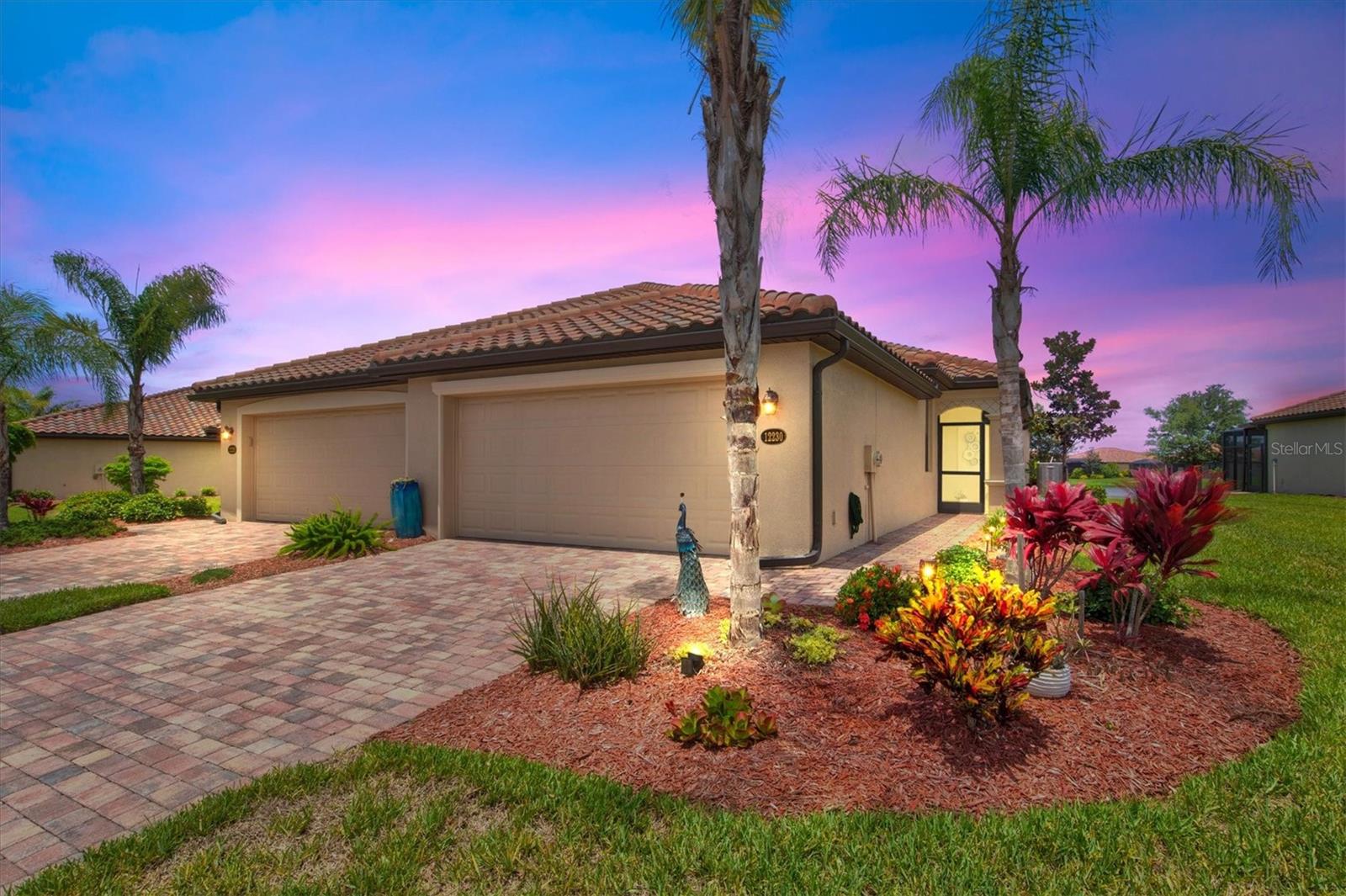Welcome to resort style living... this is a home that whispers comfort, elegance, and serenity. This is a perfect community where you can live and play. Nestled in the highly sought-after gated community of Gran Paradiso, this beautifully designed 2-bedroom, 2-bath villa—with a den and a spacious 2-car garage—offers more than just a home. It offers a lifestyle filled with beauty, peace, and possibility.
As you step through the front door, you're greeted by an airy, open-concept living space bathed in natural light. The kitchen, thoughtfully laid out and welcoming, flows effortlessly into the family room and out to a screened-in lanai—where tranquil water views invite you to slow down, breathe deep, and savor each moment.
The primary suite is a sanctuary all its own, featuring dual walk-in closets and a spa-like en suite bath with a fully tiled walk-in shower and dual vanities—perfect for moments of quiet self-care. A charming guest bedroom and bath, a versatile den framed with elegant French doors, and a convenient interior laundry room make this villa as functional as it is beautiful.
Life at Gran Paradiso feels like a permanent vacation. Spend your days lounging by the resort-style pool, working out in the state-of-the-art fitness center, or playing pickleball and bocce with neighbors who soon feel like family. With the wonderful Gulf beaches, fine dining, and boutique shopping just minutes away, everything you need is right at your fingertips.
This isn’t just a home—it’s a feeling.
Come experience the warmth, the grace, and the lifestyle you've been dreaming of in Southwest Florida.
Welcome home.