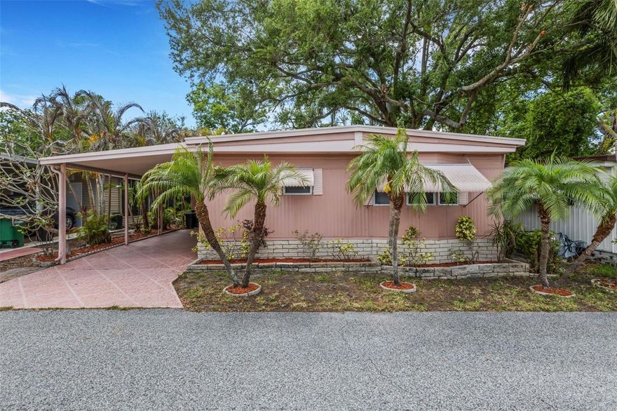 VERY MOTIVATED SELLERS! PRICE JUST REDUCED! Welcome to your beautifully furnished retreat, perfectly situated on a dry lot in an X flood zone, offering peace of mind and privacy. This well-maintained home showcases a stunning tropical wooded backdrop, complete with a serene, meandering stream that creates a truly picturesque and tranquil setting. Inside, the home has been thoughtfully cared for, including upgraded ¾-inch plywood subflooring for added durability. The property has been regularly inspected underneath, and the roof-over adds extra protection and longevity. Located in the highly sought-after Briar Creek community, this property includes deeded land, an exceptional value. Residents enjoy a friendly neighborhood atmosphere with winding roads and majestic, mature trees that enhance the natural beauty of the area. The monthly maintenance fee of only $220 covers an impressive array of amenities, including water, sewer, trash service, lawn care, private roads, and access to the clubhouse. Relax and unwind at the heated pool and spa, enjoy a game of shuffleboard, or take advantage of the convenient on-site laundry facility and community mart for buying and donating gently used items. This pet-friendly home allows cats only. Conveniently located near numerous medical facilities, including a nearby hospital, this home offers both comfort and accessibility. If you’re seeking a private, nature-inspired setting within a welcoming and well-maintained community, this is the perfect place to call home. Room measurements are approximate, buyer responsible to verify.