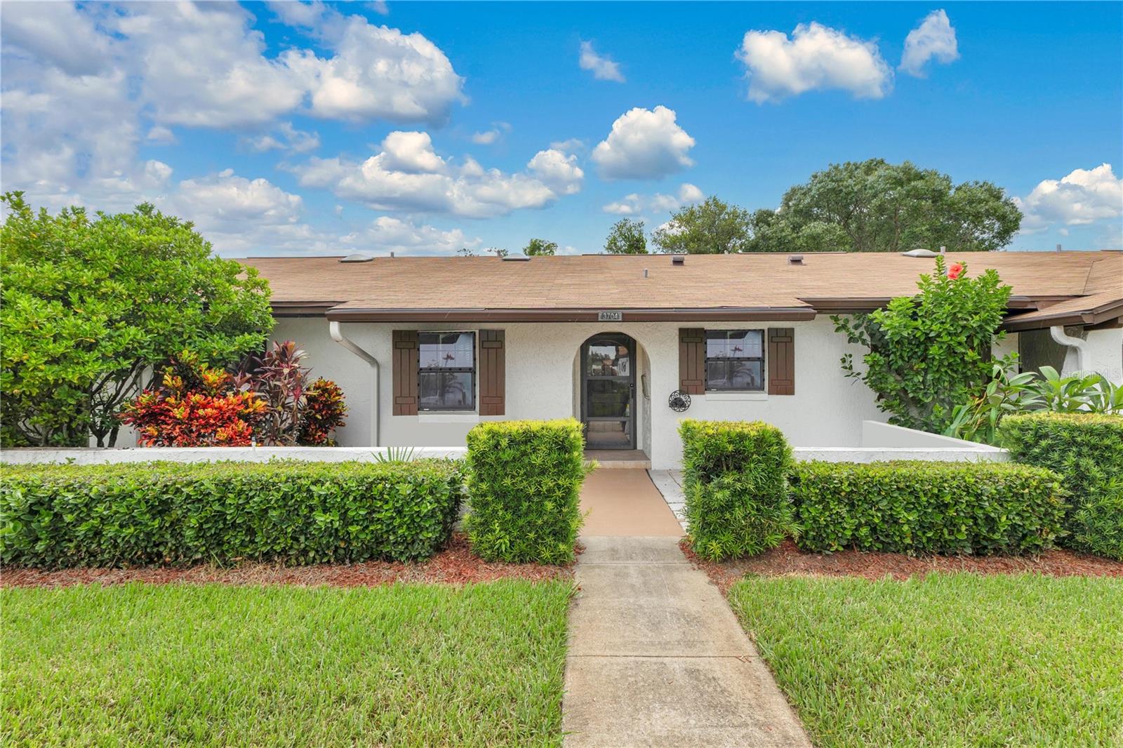 Welcome to the perfect mix of comfort, convenience, and location! This well-cared-for 2-bedroom, 2-bath home is truly move-in ready, offering a low-maintenance lifestyle so you can enjoy everything Central Florida has to offer. Step inside to an open and inviting layout featuring a spacious living and dining area that flows into a functional kitchen—perfect for everyday meals or hosting friends and family. The primary bedroom provides a cozy retreat with a private bath and generous closet space. Recent updates like the roof and A/C (both replaced in 2019) give you peace of mind, while the sparkling inground pool is the perfect spot to unwind and make the most of sunny Florida days. Located in a quiet, established community, you're just minutes away from major highways, shopping, dining, and top attractions—less than 30 minutes to Disney and only 20 minutes to Orlando International Airport. Come take a look and see why this one feels like home!