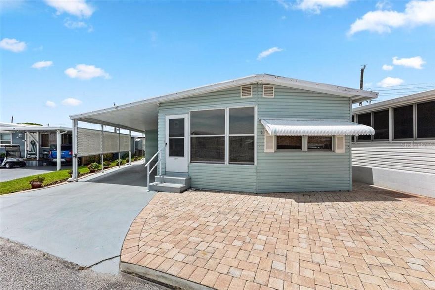 Freshly Updated 2 Bedroom, 2 Bath Home in Trailer Estates Marina Community on Sarasota Bay. This charming home features all-new appliances and has been freshly painted, offering a move-in ready experience. Enjoy a cozy screened front porch and a covered back porch, perfect for relaxing or entertaining. The generous-sized addition boasts extra tall ceilings, providing ample space for laundry, a workshop, or storage. A carport and pavered parking area completes the exterior, combining functionality with curb appeal. Located in Trailer Estates, a Special Park and Recreation District governed under Chapter 418, Florida Statutes. Residents own their land—no lot rent, CDD, or HOA fees. The annual park tax covers cable, high-speed internet, trash pickup, and access to outstanding amenities including a marina with rentable boat slips, private beach, pool, hot tub, fitness center, shuffleboard, bocce ball, pickleball, woodshop, and nearly 60 active clubs and social events. Experience one of Sarasota Bay’s most vibrant and welcoming 55+ communities.