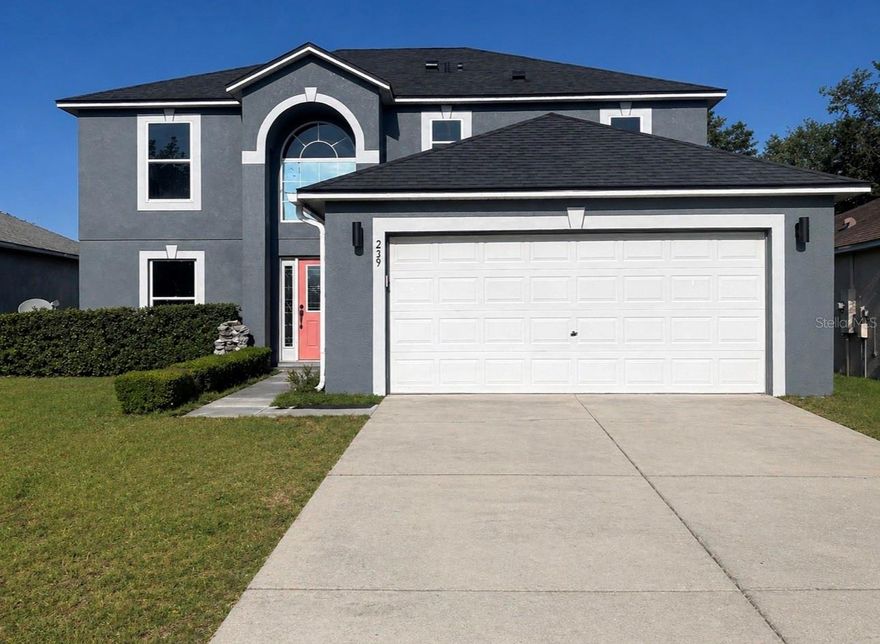 One or more photo(s) has been virtually staged. Welcome to comfort, space, and opportunity in the charming town of Groveland—known for its natural beauty and peaceful surroundings.
This inviting two-story, 4-bedroom, 2-bath home sits on an oversized lot with no rear neighbors, offering privacy and flexibility for your lifestyle. Beautiful manicured landscaping enhances the curb appeal, while the fully fenced backyard opens to serene views—perfect for relaxing evenings or even catching a glimpse of a Cape Canaveral rocket launch. Tucked away in the quiet community of Lake dot landing, this home delivers the peaceful setting buyers are searching for. Step inside to soaring ceilings and a welcoming foyer that creates an immediate sense of openness. Just off the entry is a formal dining area, along with a versatile bonus rooms downstairs—ideal for a home office, playroom, or easily adaptable for multi-generational living. The open-concept kitchen, living, and dining areas flow seamlessly, creating a functional and comfortable space for everyday living and entertaining. The kitchen features abundant cabinetry, generous counter space, and a cozy dinette area for casual meals. Upstairs, the thoughtfully designed split-bedroom floor plan offers privacy, with three secondary bedrooms and a guest bath located opposite the primary suite. The guest rooms feature brand-new carpet, built-in closets, and ceiling fans throughout. The primary suite provides a private retreat with ample closet space and an en-suite bath featuring a stand-up shower. Warm, welcoming, and thoughtfully designed, this home offers both functionality and future potential—an excellent opportunity for buyers looking for space to grow. MLS Remarks: All information recorded in the MLS is intended to be accurate; however, buyers and their agents should independently verify all details. Some photos may be virtually staged.