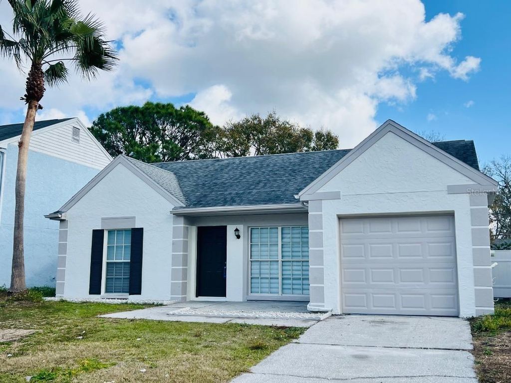 Photo of 11009 Summer Drive, Tampa, FL 33624 (MLS # TB8478565)