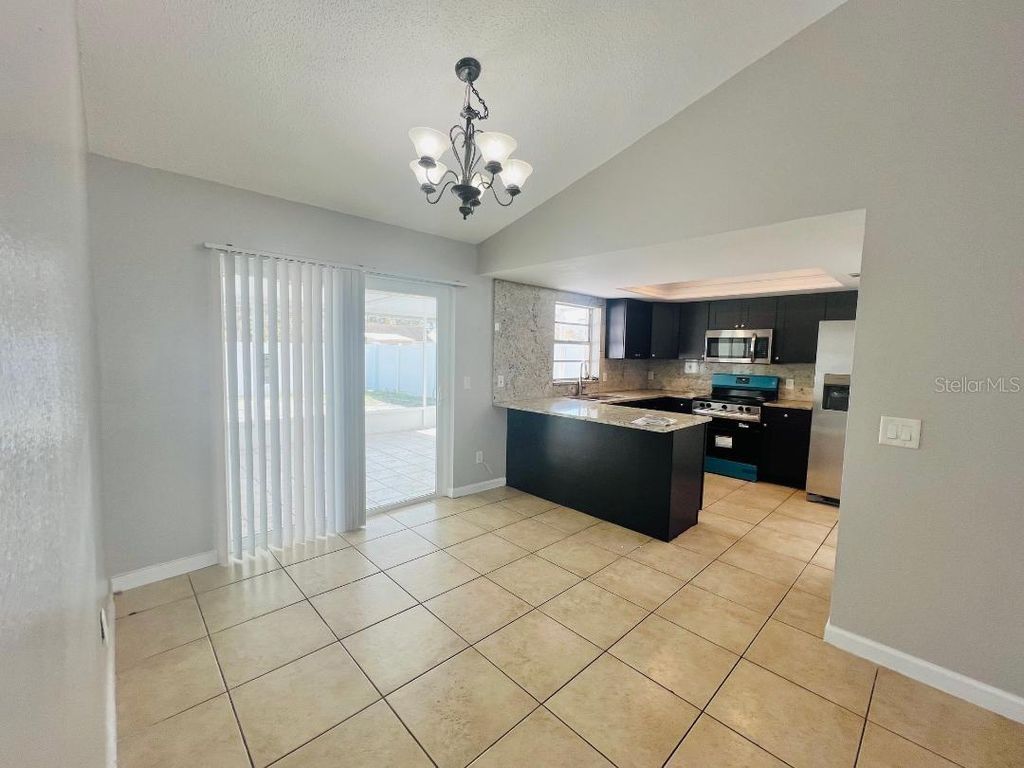 Photo of 11009 Summer Drive, Tampa, FL 33624 (MLS # TB8478565)