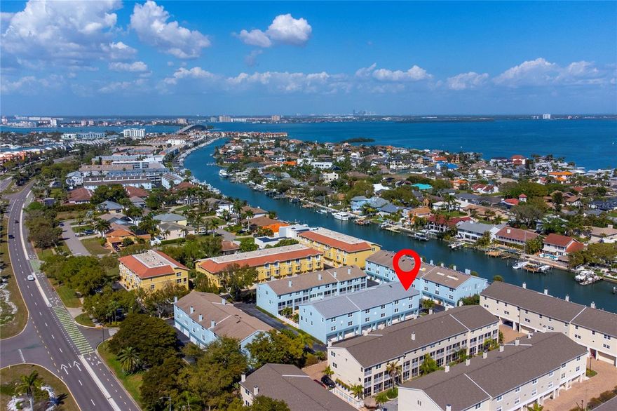 Welcome to island living at its finest in the desirable TIERRA SAILS community of Tierra Verde. This beautiful three-story, TURN-KEY (drop your bags and head to the beach!), FULLY FURNISHED END UNIT, offers nearly 2100 sq ft of spacious living with 3 bedrooms, 2.5 bathrooms, and a 2-car oversized garage, perfectly blending comfort and coastal charm. CAN ALSO BE SOLD UNFURNISHED.
The main living level (second floor) features an open concept floor plan with rich wood flooring, a custom travertine wood-burning fireplace, and sliding glass doors that lead to a screened balcony- ideal for enjoying the island breeze. The spacious designer kitchen offers granite countertops, abundant cabinetry, a breakfast bar and built-in desk making it both functional and perfect for entertaining. A convenient powder room completes this level. 
Upstairs, the primary suite provides a relaxing retreat with oak flooring, a spa-style bathroom with dual vanities, whirlpool bath, separate shower and private water closet. Two additional bedrooms share a recently updated full bathroom, and the laundry area is conveniently located on the same level. On the ground level, enjoy an additional screened patio just off the oversized garage, which is perfect for storing beach gear, bikes and all your favorite “toys”. Residents enjoy access to a HEATED community pool. This property has been historically well-maintained with a brand-new roof and complete replumbing/repiping as of 2025. Pet friendly community.
Located directly across from the shops and restaurant of downtown Tierra Verde and just minutes from the award-winning beaches and natural beauty of Fort De Soto Park, the highly thought after Isla Del Sol Yacht and Country Club (membership required), this home offers the best of Florida coastal living. Easy access to I-275 and bustling downtown St. Petersburg. Less than 10 minutes' drive to acclaimed Gulf Beaches, Don Cesar Hotel, 30 minutes to Tampa and St. Petersburg/Clearwater International Airports.