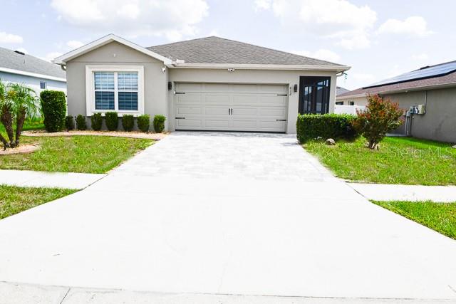 Photo of 412 Monticelli Drive, Haines City, FL 33844 (MLS # O6438407)
