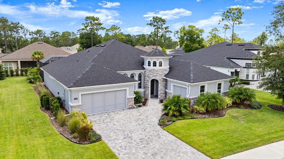 *ENJOY EXQUISITE LUXURY LIVING IN THIS STUNNING CUSTOM BUILT MEDITERRANEAN STYLE 4-BEDROOM 3-FULL BATH ESTATE POOL HOME IN BROWN'S LANDING, AN EXCLUSIVE 24/7 GATED COMMUNITY IN PORT ORANGE. IMPRESSIVE FOYER FEATURES FLOATING CABINETRY & GRANITE COUNTERS SEPARATED BY TWO COAT CLOSETS. GORGEOUS 18'' X 18'' CERAMIC TILE FLOORING FLOWS INTO SPACIOUS LIVING ROOM, BOASTING 12-FT TRAY CEILINGS, CROWN MOLDING & TRIPLE SLIDER ACCESS TO PRIVATE COVERED LANAI & PAVER POOL DECK. UPGRADED OUTSIDE LIVING SPACE IS A TROPICAL OASIS COMPLETE WITH 14-FT. RETRACTABLE SUNSCREEN & SUMMER KITCHEN WITH SINK, MARINE GRADE BLAZE GAS GRILL & REFRIGERATOR. ENJOY YEAR ROUND RELAXATION & FUN IN 37' X 15' SCREENED-IN HEATED POOL WITH WATER FEATURE & HOT TUB! GOURMET CHEF'S KITCHEN OFFERS GRANITE COUNTERS, 42'' UPPER CROWN-TOPPED WOOD CABINETRY, SUBWAY TILE BACKSPLASH, STAINLESS APPLIANCES, LARGE PANTRY & EXPANSIVE ISLAND. 13' X 11' CASUAL DINING NOOK WITH CUSTOM GLASS FRONTED CABINETRY, EXTENDED COUNTER SPACE & BEAUTIFUL POOL VIEWS... FRENCH DOOR ENTRY INTO PRIVATE FORMAL DINING ROOM WITH CROWN MOLDING & TRIPLE ARCH WINDOWS FOR MORE ELEGANT OCCASIONS OR USE FOR HOME OFFICE OR DEN.SPLIT BEDROOM PLAN CREATES A RELAXING RETREAT FOR EVERYONE. BEAUTIFUL PRIMARY SUITE FEATURES WALL OF WINDOWS W/CUSTOM WINDOW TREATMENTS & SPA-LIKE BATH FEATURING GARDEN TUB, OVERSIZED WALK-IN SHOWER W/DECORATIVE TILE WORK, SPLIT SINK VANITIES W/QUARTZ COUNTERS & IMPRESSIVE WALK-IN CLOSET, PLUS A LINEN CLOSET. SEPARATE WING WITH TWO GUEST BEDROOMS & FULL BATH. ANOTHER PRIVATE WING WITH 4TH BEDROOM AND FULL BATH/POOL BATH.... HOME ALSO INCLUDES, UPGRADED LANDSCAPING, CERAMIC HEAT BLOCKING FILM ON NORTH, SOUTH AND WEST WINDOWS...CUSTOM WINDOW TREATMENTS, INSIDE LAUNDRY ROOM W/CABINETS, FOLDING COUNTER & EXTRA LOFT STORAGE SPACE. THREE CAR GARAGE, SPLIT W/TWO CAR ENTRANCE OFF KITCHEN & SEPARATE ONE CAR SIDE-ENTRY GARAGE PERFECT FOR GOLF CART, MOTORCYCLES OR SMALLER VEHICLE. DRIVEWAY, LANAI AND POOL DECK PAVERS ARE SANDED AND SEALED, VIVINT SECURITY SYSTEM W/GLASS BREAK AND WATER SENSORS, 120-GALLON IN-GROUND PROPANE TANK W/PROPANE CONNECTION FOR GRILL & PORTABLE GENERATOR... RETRACTABLE SUN SCREEN COMES W/10 YEAR WARRANTY & 50" SAMSUNG TV. BROWNS LANDING IS A PRIVATE COMMUNITY, BUT CONVENIENTLY LOCATED NEAR SHOPS, RESTAURANTS AND MEDICAL SERVICES... LESS THAN 10-MILES TO THE WORLD'S MOST FAMOUS BEACH, DAYTONA INTERNATIONAL SPEEDWAY AND DAYTONA INTERNATIONAL AIRPORT...