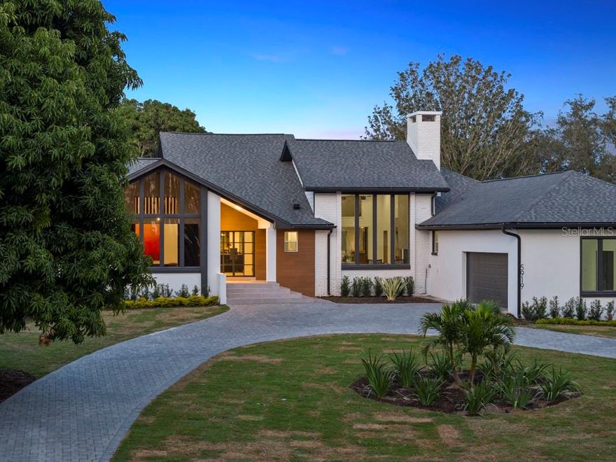 Indulge in the ultimate blend of sophistication and serenity at this remarkable residence, offering the best of both worlds with panoramic views of the 4th hole and a private boat house with a dock providing direct access to Tibet Lake on the Lake Butler Chain. Meticulously crafted by Davila Homes, this 4,175 square foot masterpiece reflects a harmonious fusion of opulence, comfort, and lakeside living.

Step inside to discover a home that has undergone a complete transformation, where exquisite finishes and tasteful design elements create an atmosphere of refined luxury. The expansive floor plan and living area welcome you with abundant natural light streaming through large windows, setting the stage for a bright and inviting ambiance.

The chef-inspired kitchen is a culinary haven, fully equipped with state-of-the-art appliances, custom cabinets, and beautiful countertops, ensuring a seamless blend of functionality and aesthetics. It's a dream kitchen that caters to both culinary enthusiasts and those who appreciate the finer details of gourmet living.

Venture outdoors to an equally impressive oasis, featuring a brand-new pool, an outdoor summer kitchen, and ample space for relaxation and entertainment. The private dock beckons, offering convenient access to the waters of Tibet Lake. Whether you seek a leisurely day of boating or fishing, this home provides the ideal backdrop for lakeside living.

A rare gem in Bay Hill, one of only three homes with such distinctive features, this residence stands as a testament to exclusivity. Bay Hill is renowned for hosting the illustrious Arnold Palmer Invitational and is home to the distinguished Arnold Palmer's Bay Hill Club and Lodge. Located in close proximity to everything Dr. Phillips has to offer, including exceptional restaurants, top-notch schools, and easy access to major highways, this property embodies the epitome of luxury, comfort, and the quintessential Florida lifestyle. Don't miss the opportunity to make this exceptional residence your own!