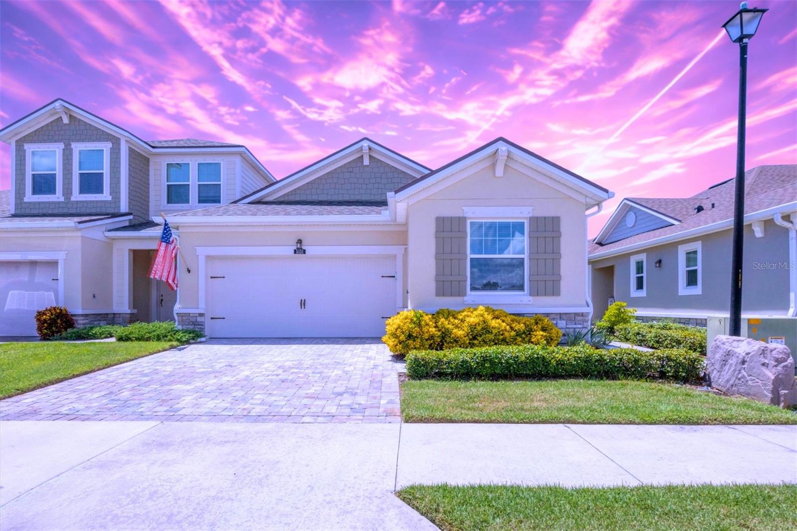 Welcome to this light-filled 2018 villa, offering a prime location in the HEART OF SARASOTA. Designed with a thoughtful OPEN CONCEPT and split floor plan, the residence features two spacious bedrooms, two full baths, and a versatile flex space ideal for a home office or den. The home’s cohesive design showcases Ventura plank TILE FLOORING THROUGHOUT, creating an elevated and timeless aesthetic. The gourmet kitchen is appointed with quartz countertops, stunning cabinetry with abundant storage, upgraded stainless steel appliances, and TWO EXPANSIVE ISLANDS’, one with seating, all flowing into the living and dining areas for effortless entertaining. Sliding glass doors open from the living room to a screened lanai with dual ceiling fans, extending the living space into an indoor/outdoor oasis. The owner’s retreat is a private haven with a large walk-in closet, tray ceiling, and your own direct lanai access through sliding glass doors. The expansive En Suite bath boasts quartz counters, a roomy frameless shower, a private water closet, dual sinks and custom cabinetry.
Additional interior highlights include 9-foot ceilings, 8-foot doors, ceiling fans, window blinds, and a home security system. Outdoor features elevate this villa further with a two-car garage enhanced by Gorilla epoxy flooring, Park Place OVERHEAD STORAGE RACKS, a BRICK PAVER DRIVEWAY, and a galvanized steel hurricane shutter system for peace of mind. The community amenities include a heated pool, lawn maintenance, sidewalks and gated security with two points of access—all with low association fees. Situated close to downtown Sarasota, St. Armands Circle, Sarasota Memorial Hospital, and the world-famous Siesta Key Beach, this residence offers an exceptional lifestyle for those seeking either a full-time home or a seasonal retreat. Fine dining, cultural arts, and the Florida life you crave is right here at 5131 Flag Street! Call for your private or FaceTime tour today…