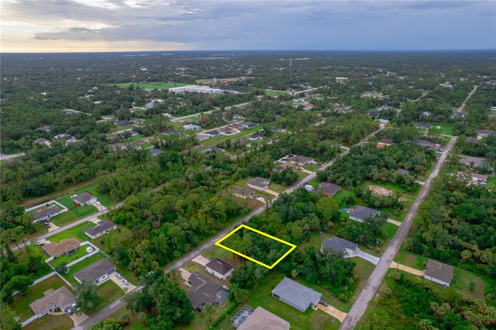 Take advantage of this fantastic opportunity to own a residential lot in the growing city of North Port, Florida. Located in the desirable Atwater subdivision, this 80x125 (10,000 sq ft) lot offers plenty of space to build your ideal home with no HOA fees and no CDD. Situated on Lakeport Street, this property features western exposure, paved road access, and is zoned RSF2 The neighborhood is quiet yet conveniently close to I-75, shopping, schools, and other amenities. The lot is not in a flood zone, has no wetlands, and offers public road access with no water frontage.