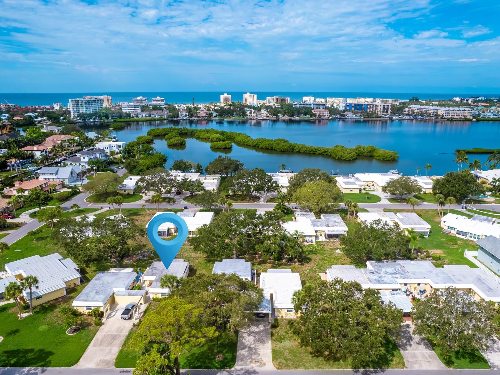 No storm damage, no water intrusion. HOA fee covers hurricane insurance. This beautifully updated two-bedroom, two-bath detached villa is located in the coveted waterfront community of Baywood Colony just 2 miles from world-famous Siesta Key Beach. This villa features new windows, luxury vinyl flooring, 2023 AC, air-conditioned lanai and a private courtyard. Bonus: the villa is being offered turnkey-furnished. Enjoy the maintenance-free lifestyle of a condominium with the privacy of a single-family home. Private laundry and storage room are located off of the carport. Baywood Colony has a waterfront park for residents to enjoy sunset strolls, fish from the seawall and enjoy activities at the community pool and clubhouse. Sellers own the villa next door and have listed both villas for sale. This is a unique opportunity to own two villas located next door to one another. Ideal for multigenerational living or ease of managing multiple income-producing properties.