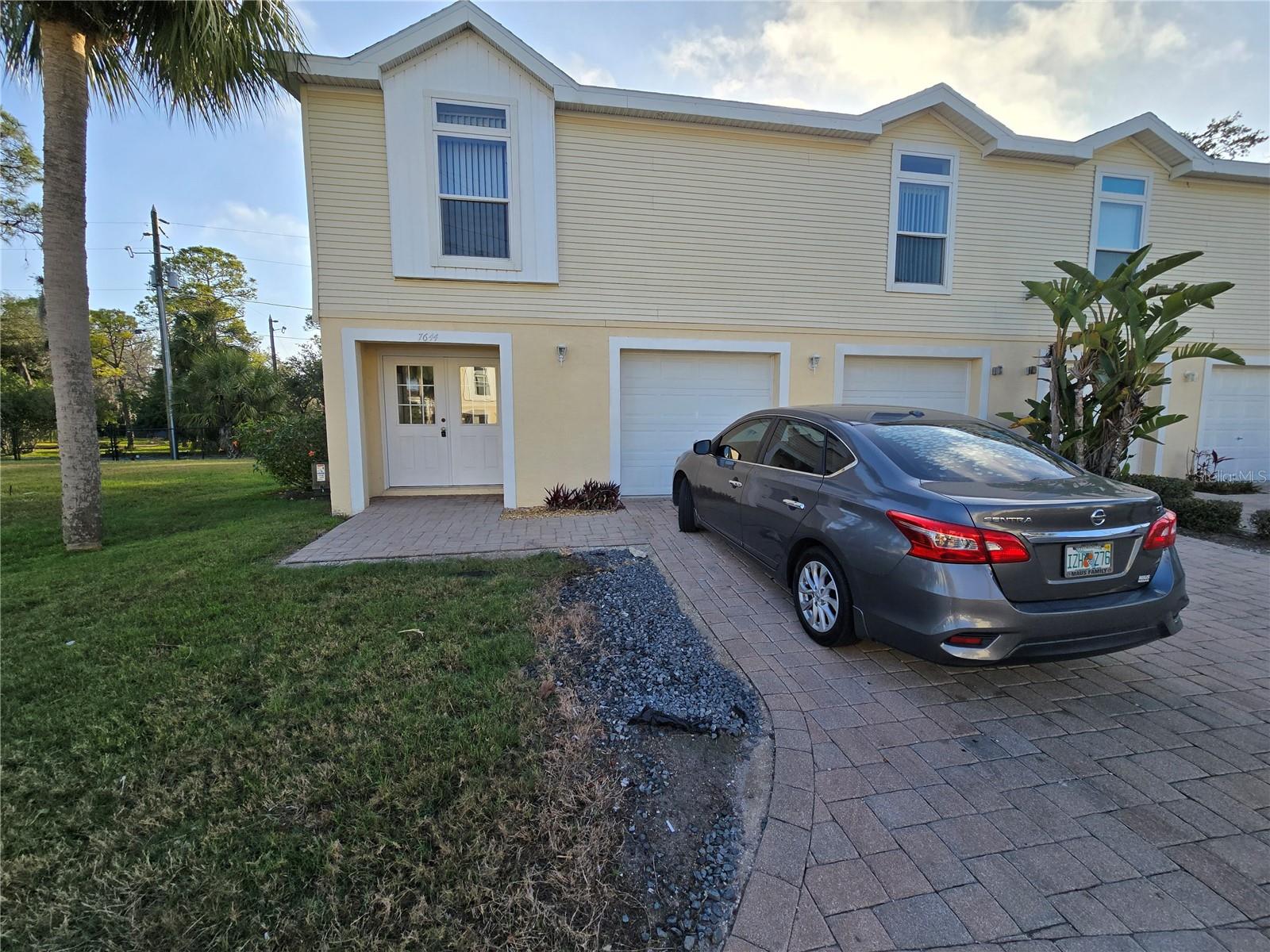 Lovely Unfurnished Annual Rental. Beautiful 3-bedroom, 2-bath, 2-car-garage condo with all of the living area on the second floor. Newer Roof, new carpet in bedrooms, and interior painted in 2024! This 2 car garage is deep enough to fit 4 cars. Lawn care and trash included in rent. The living space features a kitchen with snack bar and pantry, nice size bedrooms, living room/dining room combo, and inside utility closet in kitchen with washer/dryer hook-ups. Huge garage with lots and lots of storage space! Community pool. Close to the Cotee River and Gulf! Resort style living! Very nice!
