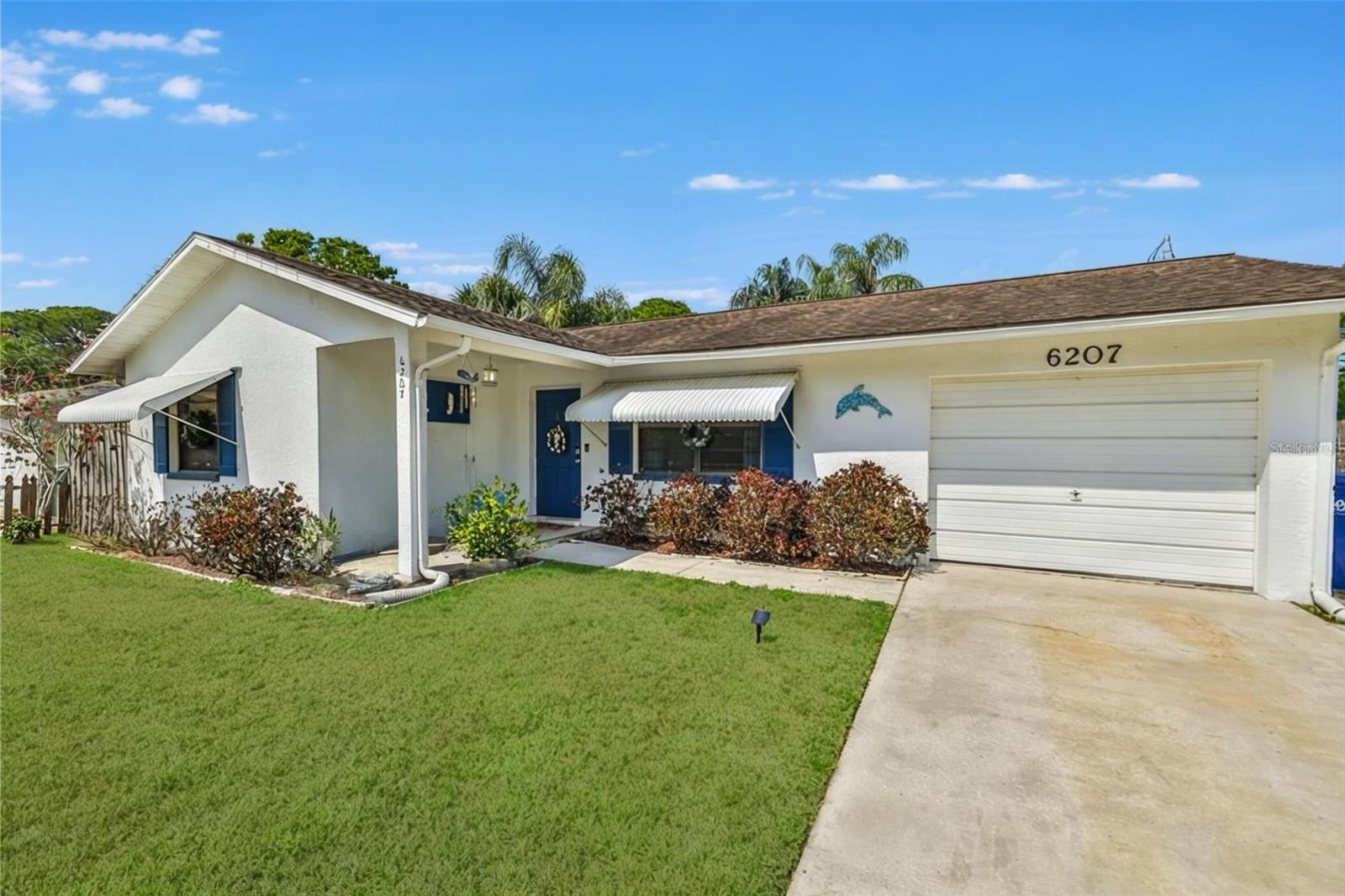 One or more photo(s) has been virtually staged. Welcome to 6207 57th Ave N in St Petersburg! This charming 2-bedroom, 2-bathroom home offers 1,182 sqft of living space with a versatile layout. Inside, you'll find a spacious living room and a bright kitchen featuring stainless steel appliances. The kitchen's dining area opens to a screened lanai overlooking the fenced backyard, complete with a powered storage shed - perfect for a workshop or hobby space. Both bedrooms feature large closets, with the primary bedroom offering two closets plus a linen closet for extra storage. A bonus office/laundry room adds functionality and could easily be used as a flex space. The garage has been converted but can be reverted back to a single-car garage or even a third bedroom. New Roof Installed. Located in a quiet neighborhood just minutes from downtown St Petersburg, this home offers easy access to shopping, dining, parks, and Gulf beaches. Schedule your showing today and see this home's potential!