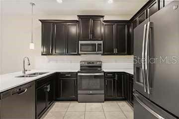 Photo of 4642 Tribute Trail, Kissimmee, FL 34746 (MLS # O6436387)