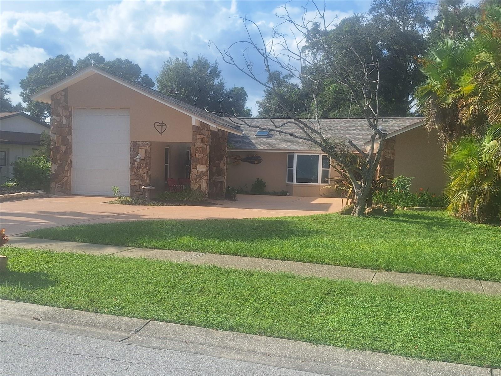 FANTASTIC 3BR 2BATH HOME IN DESIRABLE LAKESIDE ESTATES!! BRAND NEW ROOF! CUSTOM MAIL BOX! NEW TANKLESS WATER HEATER! FRESHLY PAINTED INSIDE AND OUT! NEW SCREEN PATIO! ONE OF A KIND RV GARAGE FOR ALL THE BIG TOYS OR ROOM FOR MULTI CAR LIFT PLUS AN ADDITIONAL FULL 2 CAR GARAGE! BONUS ROOM FOR CRAFTS ETC! AMAZING SECRET MANCAVE WITH DUCTLESS HEATPUMP! LESS THAN 1 YEAR OLD KITCHEN APPLIANCES WITH WIFI MICROWAVE! QUARTZ COUNTERTOPS! LARGE DRIVEWAY FOR OVERFLOW PARKING! VINYL FENCING W/ 12FT GATE! CUSTONM BUILT CABINETS IN BATHROOMS W/ GRANITE COUNTERS! LUXURY SHOWER SYSTEM IN MASTER BATH! BEAUTIFUL FIREPLACE IN FAMILY ROOM! PUTTING GREEN! SOARING TREES AND FLORIDA NATIVE LANDSCAPING! ROOM FOR POOL! OFFERED AT $739,000